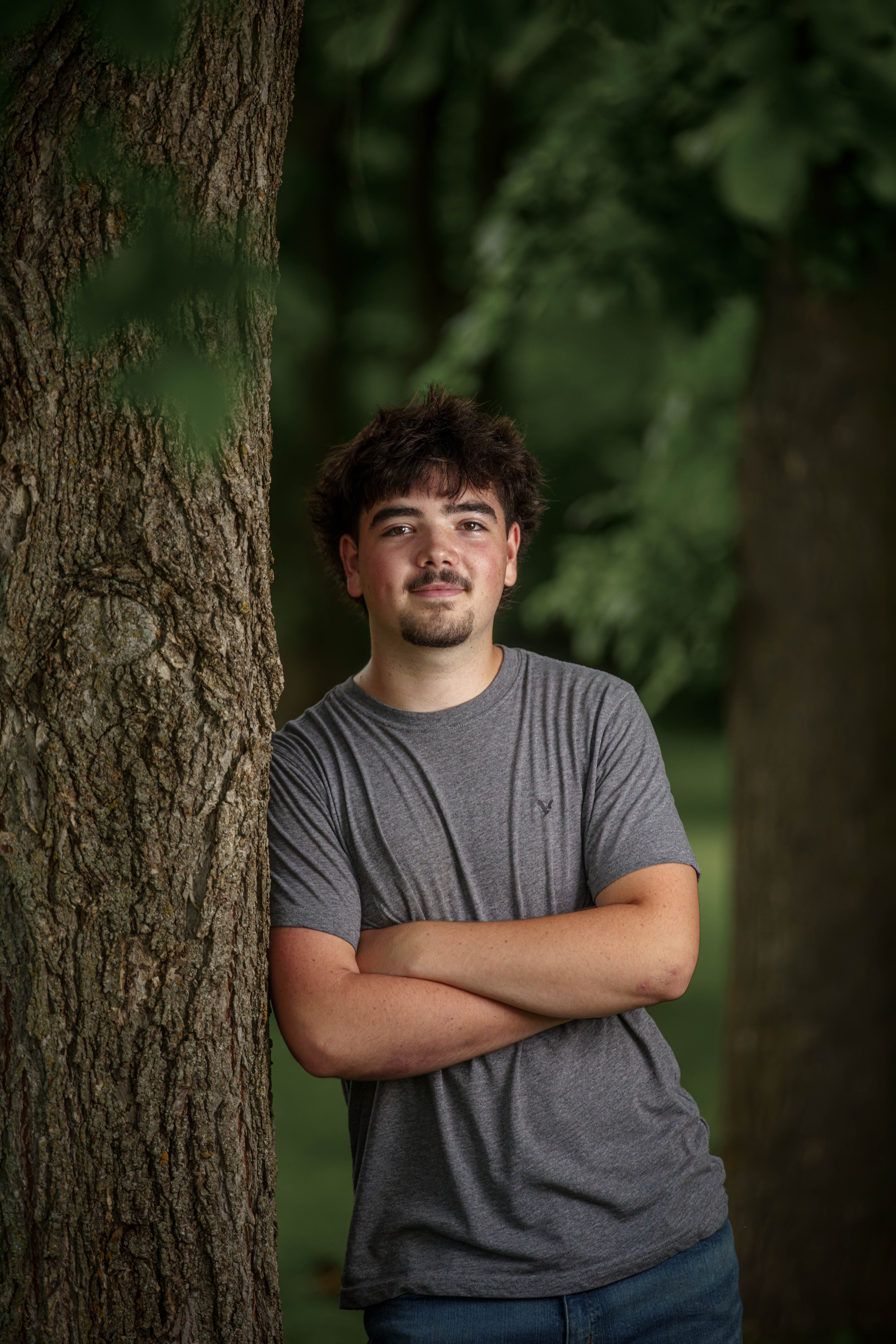 Brady Stuart poses for senior photos outside Monroe Wisconsin on August 4th, 2025. Stuart will graduate in 2026. Photography by Ross Harried for Second Crop Creative.
