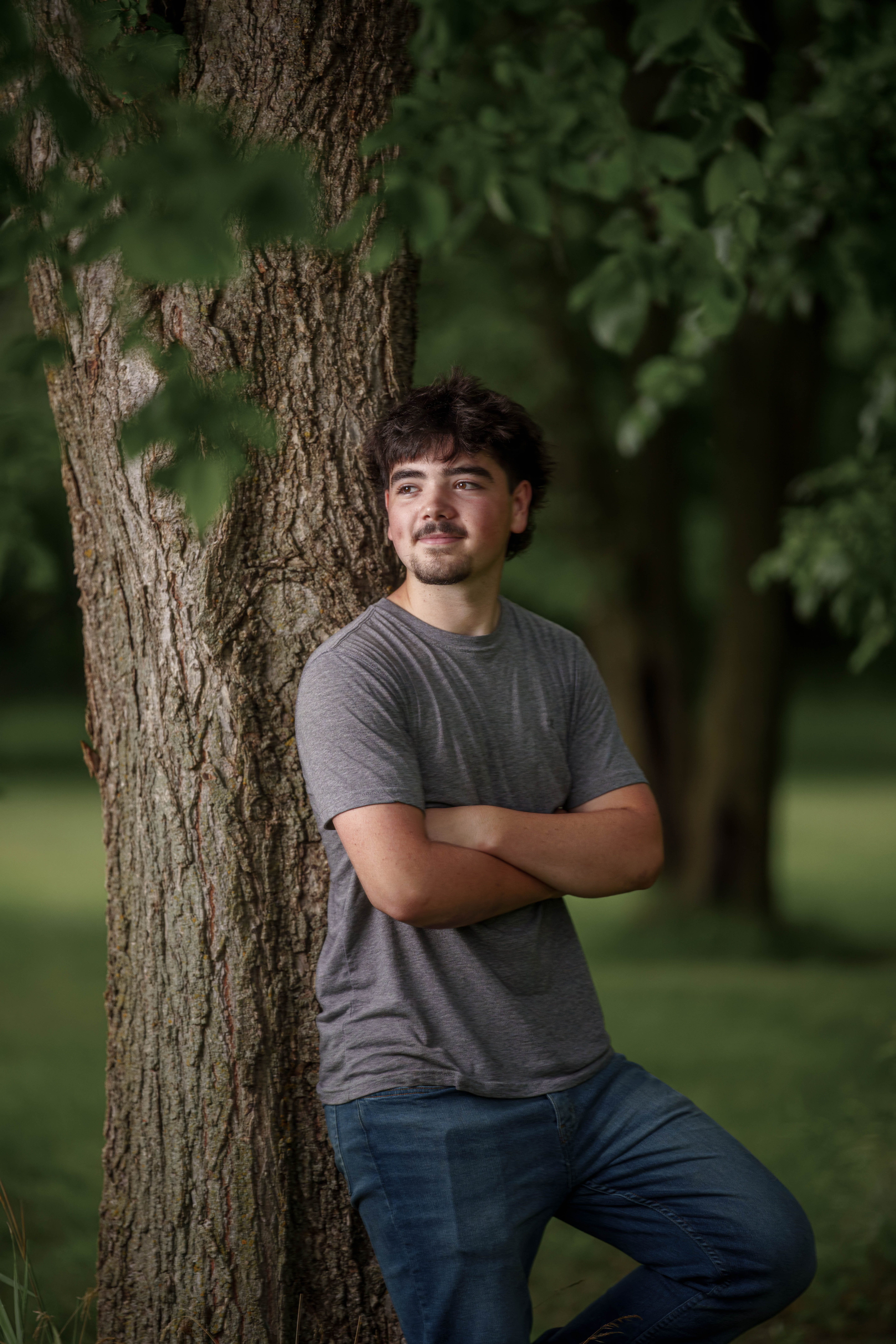 Brady Stuart poses for senior photos outside Monroe Wisconsin on August 4th, 2025. Stuart will graduate in 2026. Photography by Ross Harried for Second Crop Creative.