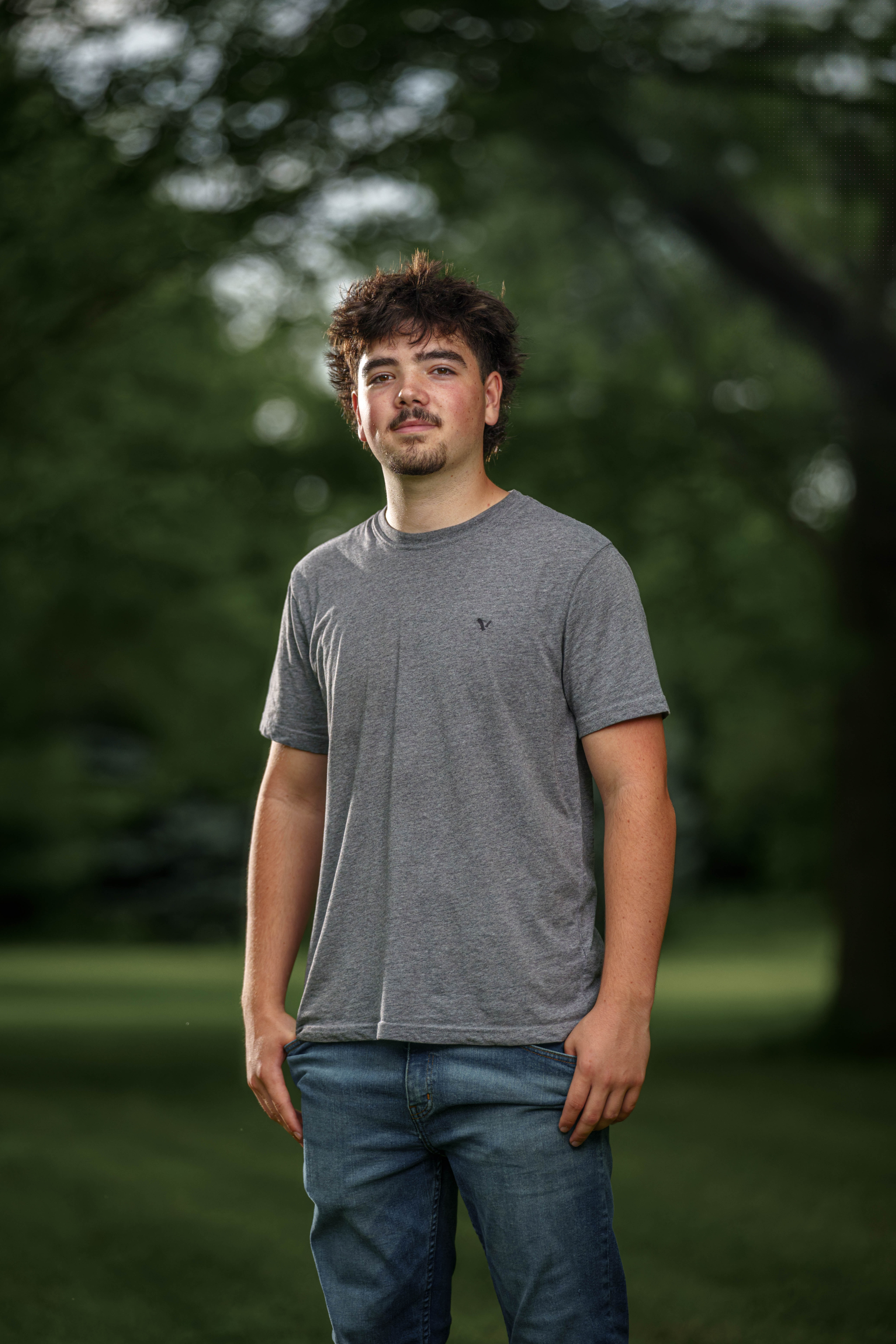 Brady Stuart poses for senior photos outside Monroe Wisconsin on August 4th, 2025. Stuart will graduate in 2026. Photography by Ross Harried for Second Crop Creative.
