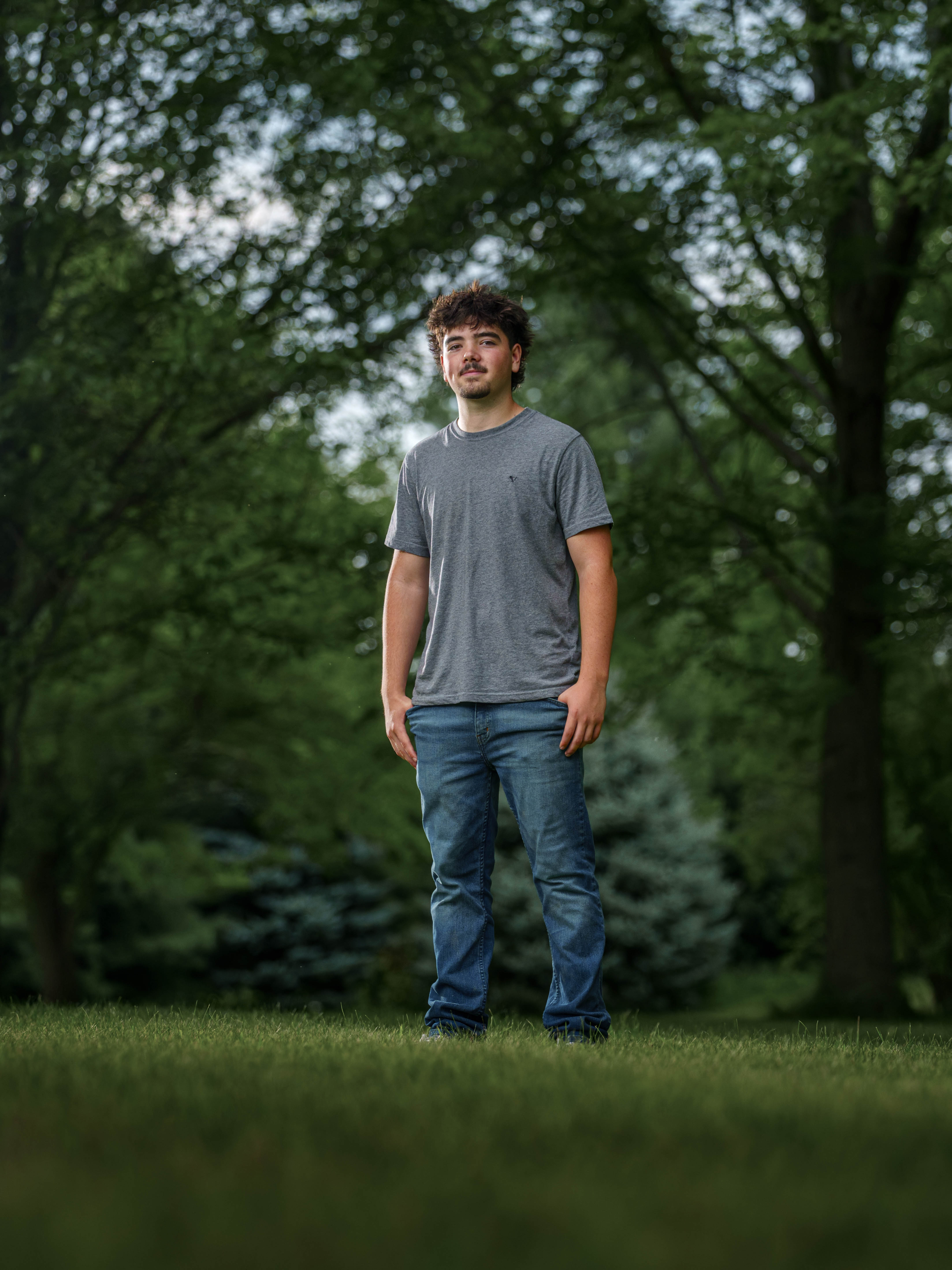 Brady Stuart poses for senior photos outside Monroe Wisconsin on August 4th, 2025. Stuart will graduate in 2026. Photography by Ross Harried for Second Crop Creative.