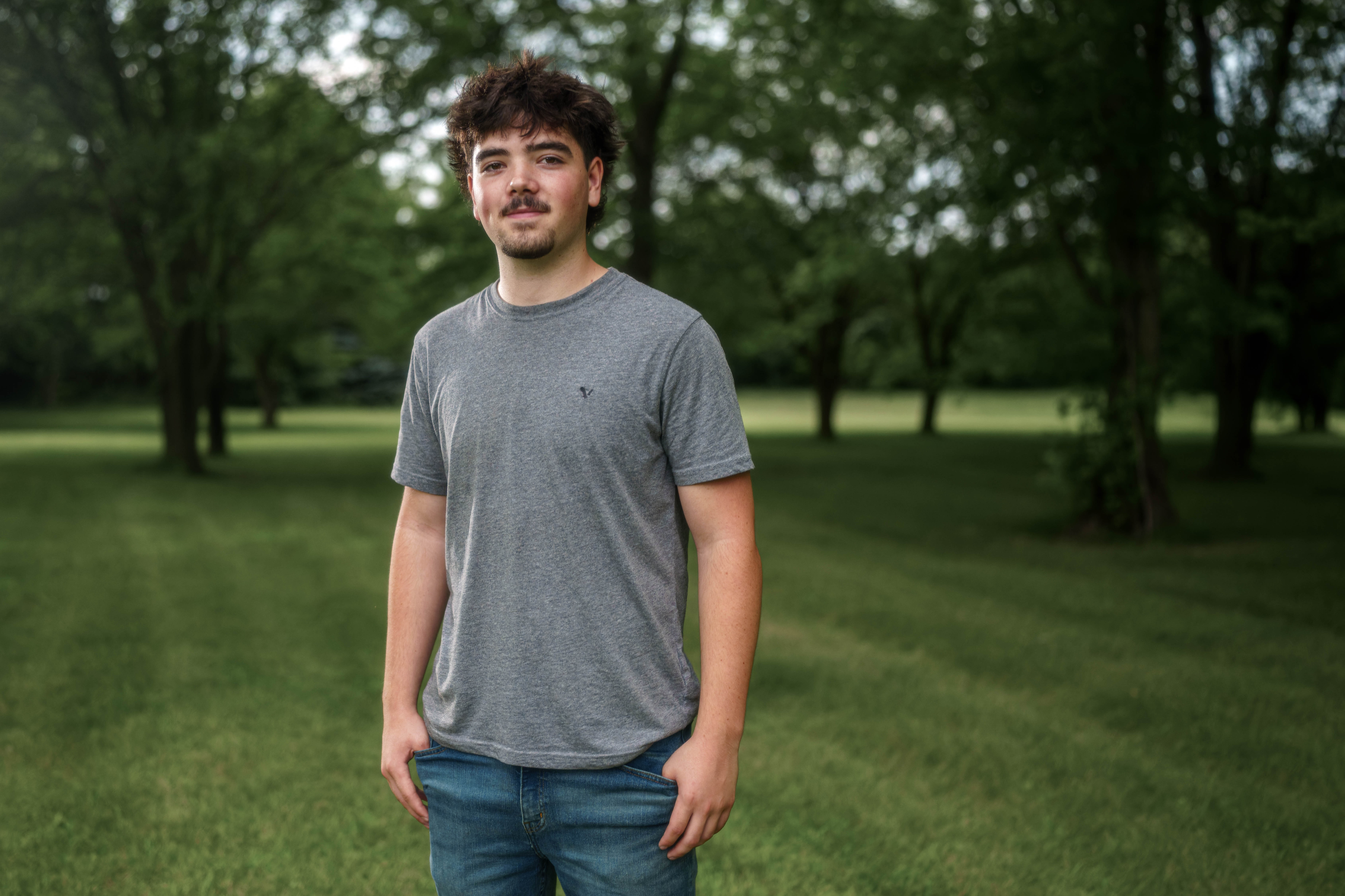 Brady Stuart poses for senior photos outside Monroe Wisconsin on August 4th, 2025. Stuart will graduate in 2026. Photography by Ross Harried for Second Crop Creative.