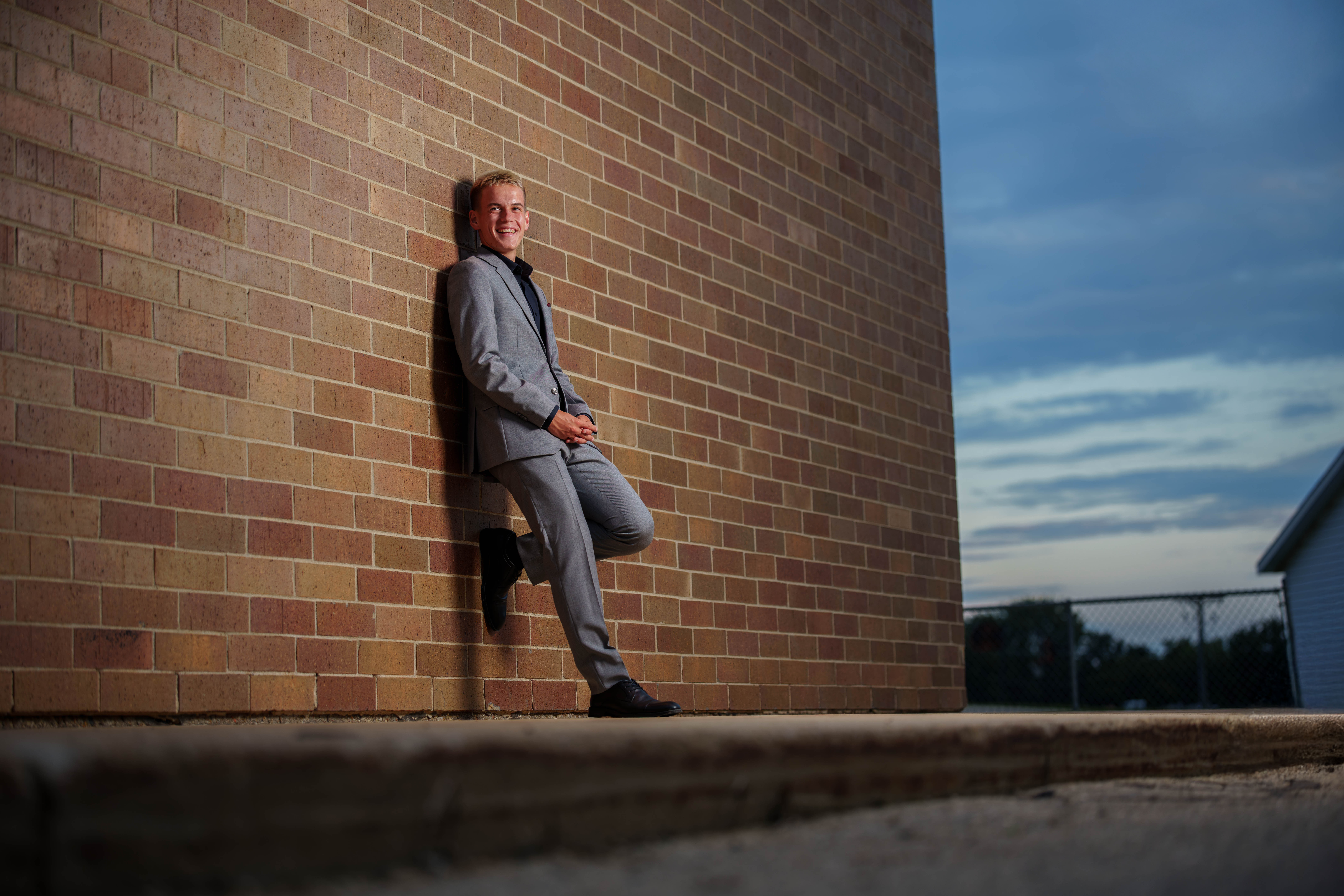 Tre Dammen poses for senior photos in Monroe Wisconsin on August 11th, 2025. Dammen will graduate in 2026. Photography by Ross Harried for Second Crop Creative.