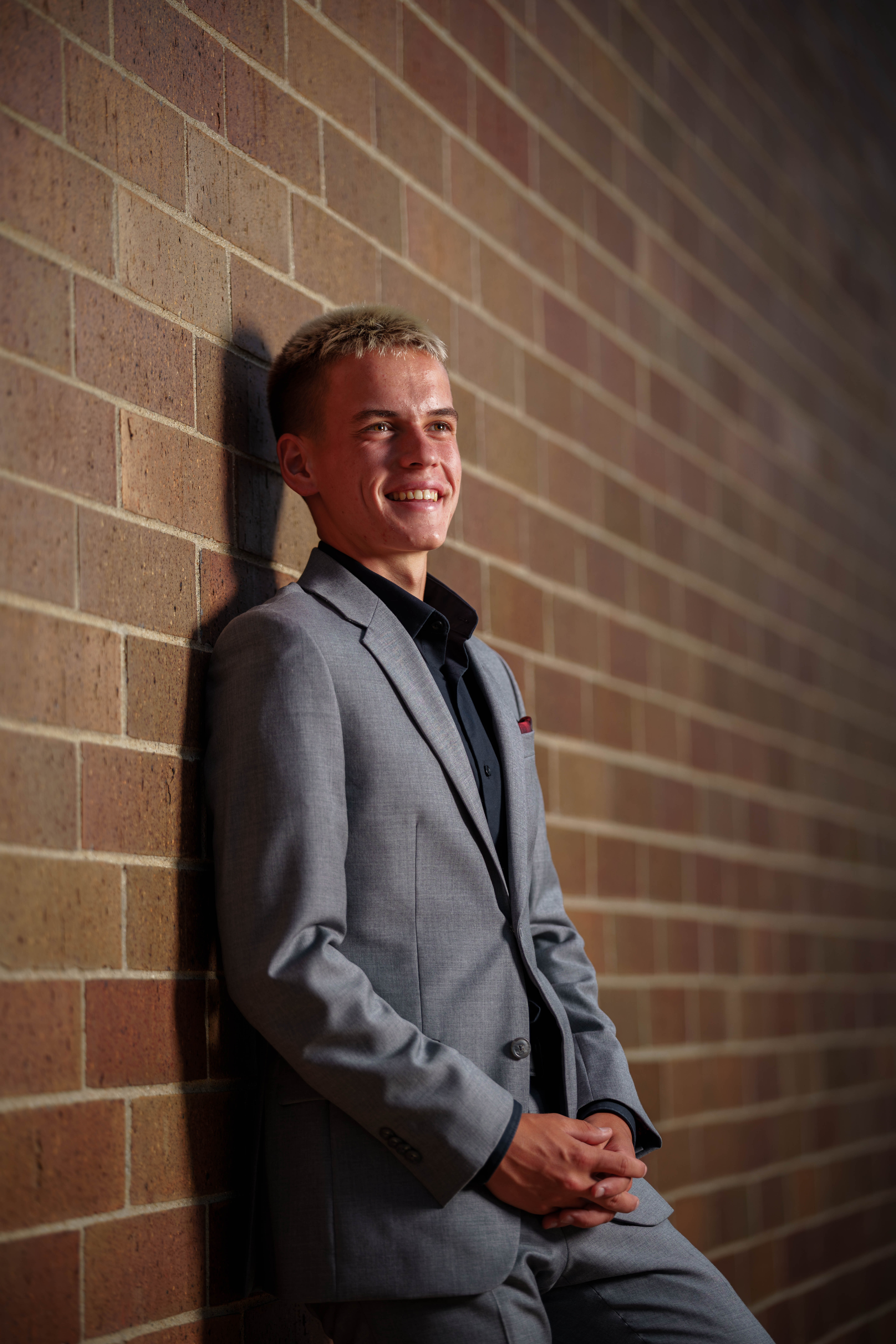 Tre Dammen poses for senior photos in Monroe Wisconsin on August 11th, 2025. Dammen will graduate in 2026. Photography by Ross Harried for Second Crop Creative.