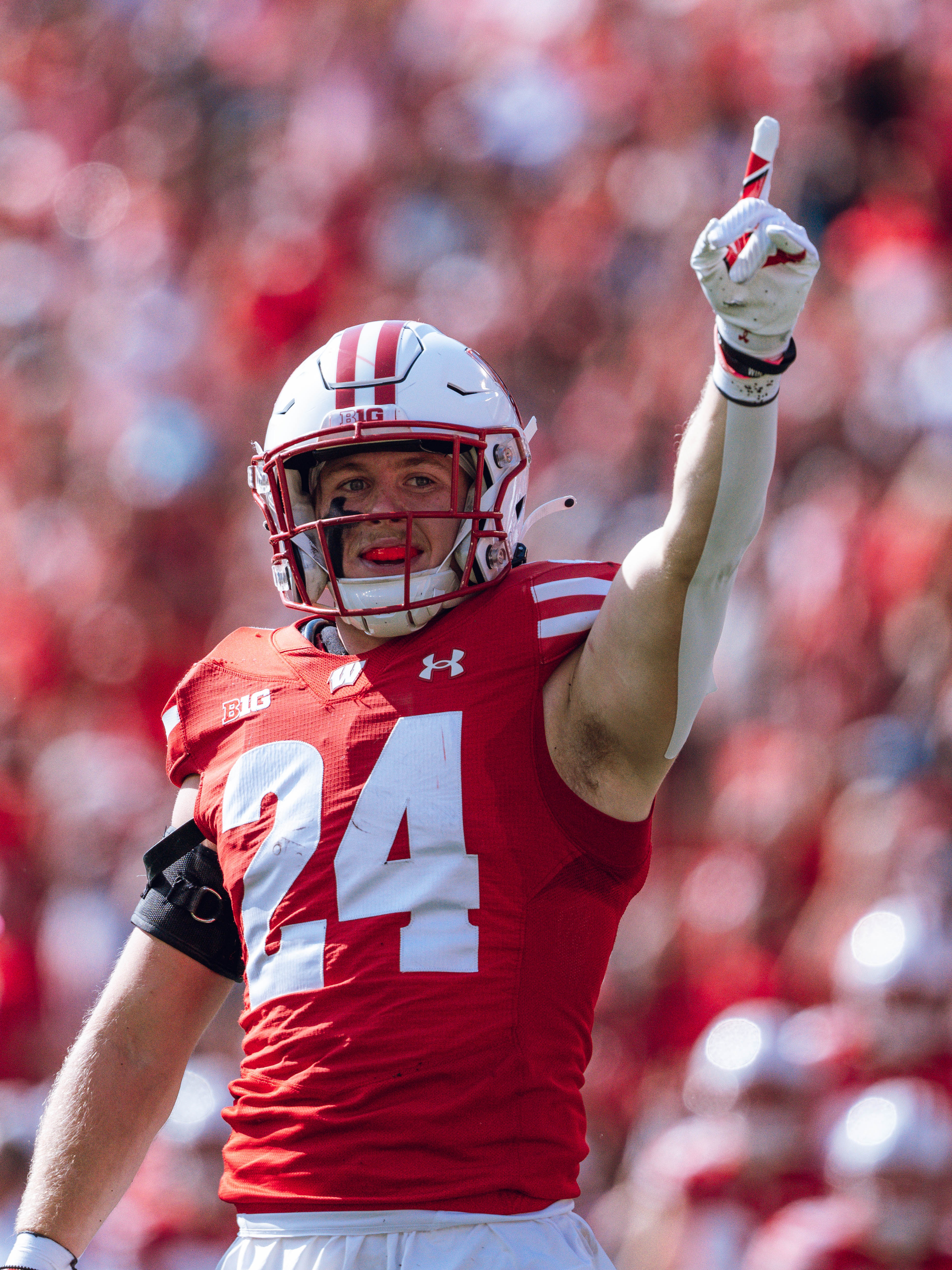 Wisconsin Badgers safety Hunter Wohler #24 celebrates a fumble recovery on special teams against the Purdue Boilermakers at Camp Randall Stadium on October 5, 2024 in Madison, Wisconsin. Photography by Ross Harried for Second Crop Sports.