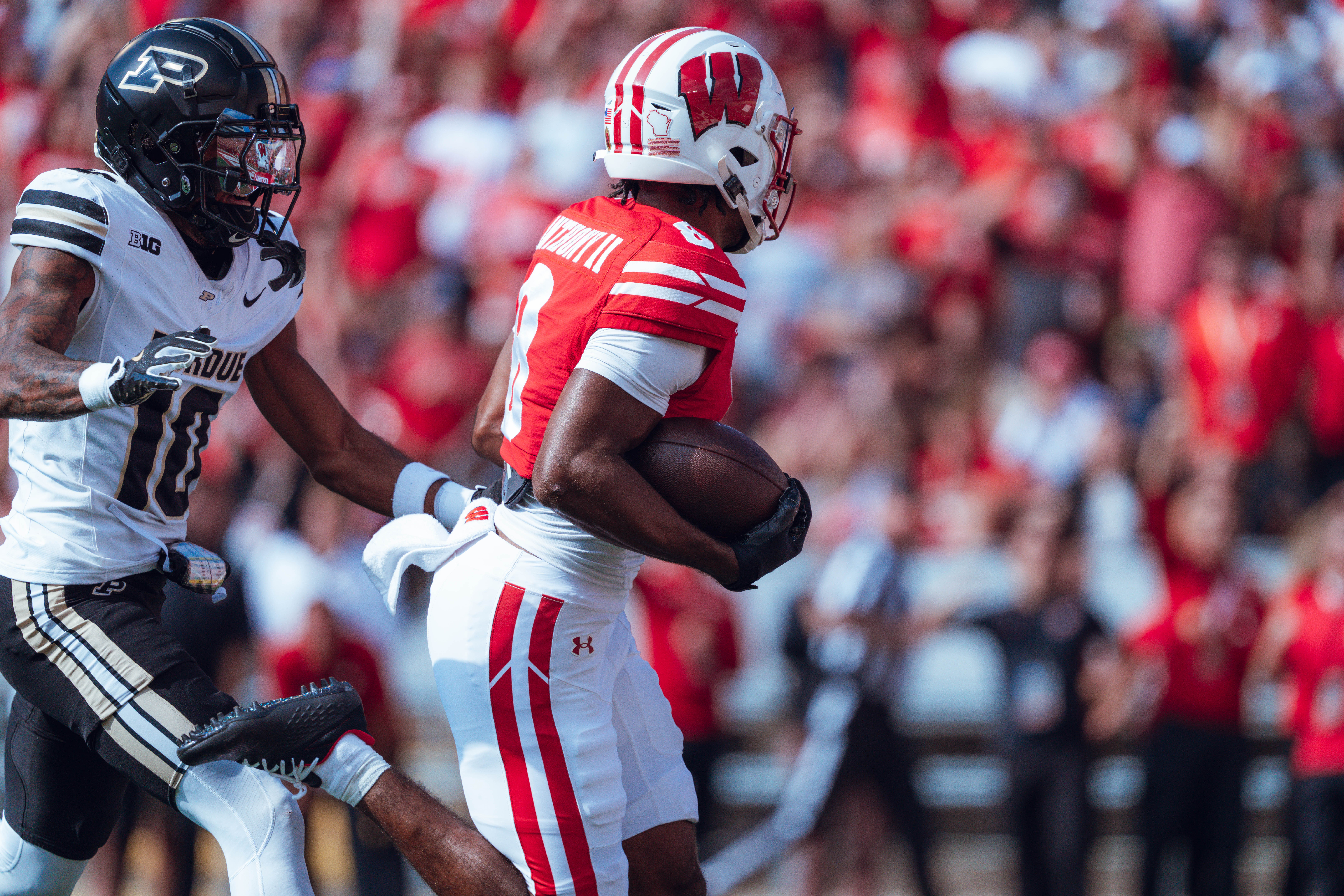 Wisconsin Badgers wide receiver Vinny Anthony II #8 out runs the Purdue Boilermakers for a touchdown at Camp Randall Stadium on October 5, 2024 in Madison, Wisconsin. Photography by Ross Harried for Second Crop Sports.