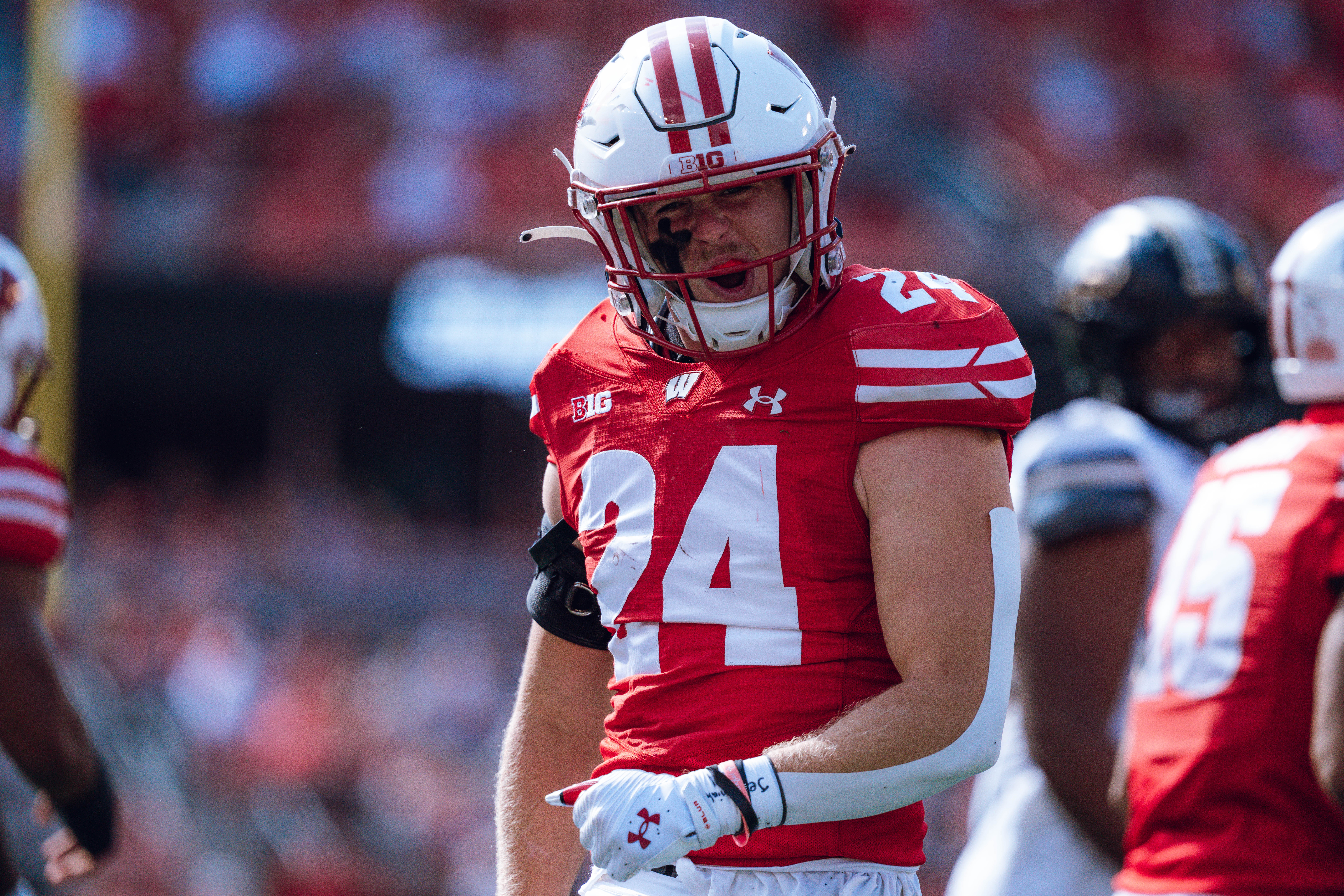 Wisconsin Badgers safety Hunter Wohler #24 celebrates a hard hit against the Purdue Boilermakers at Camp Randall Stadium on October 5, 2024 in Madison, Wisconsin. Photography by Ross Harried for Second Crop Sports.