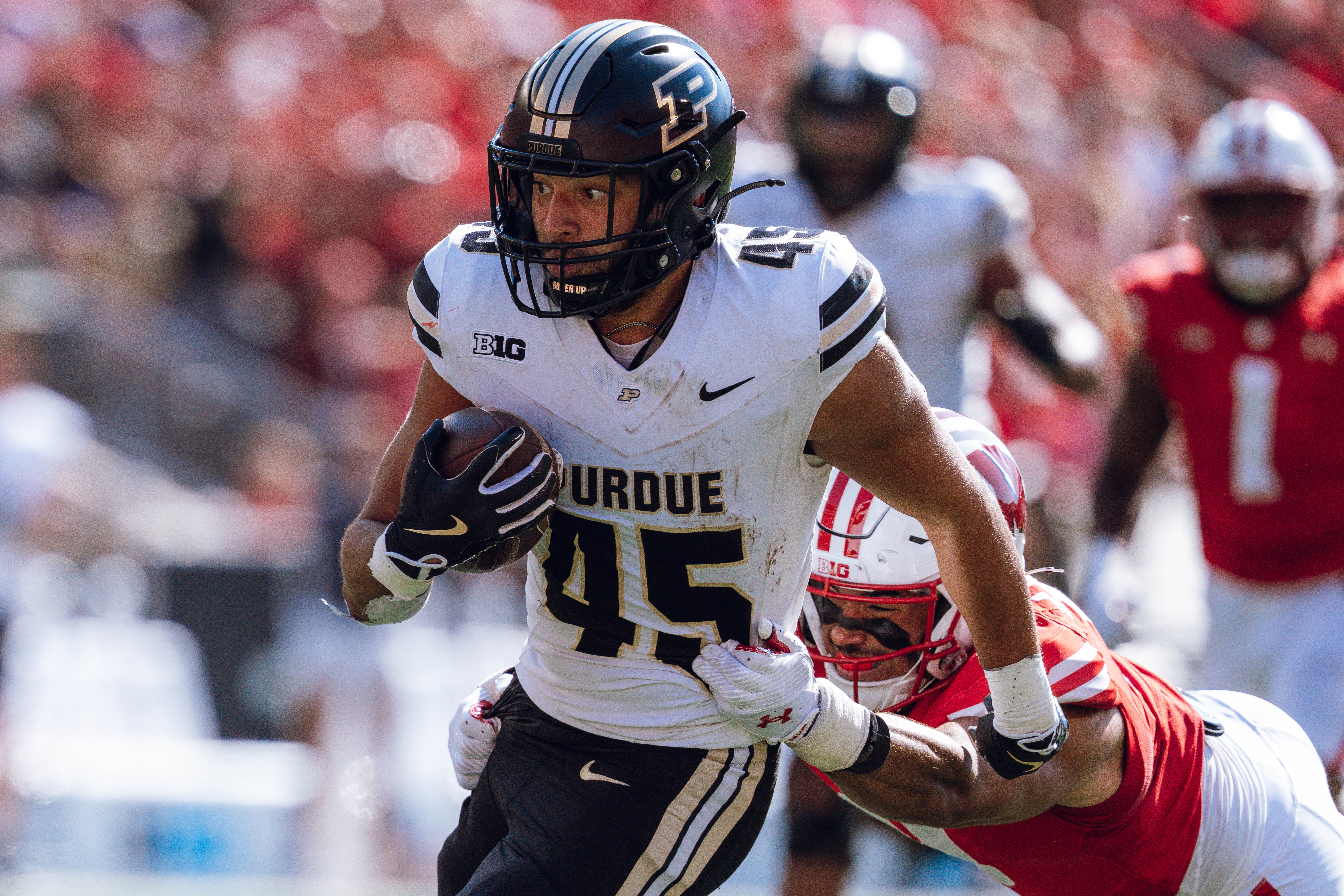 Purdue Boilermakers running back Devin Mockobee #45 runs up field after a reception against the Wisconsin Badgers at Camp Randall Stadium on October 5, 2024 in Madison, Wisconsin. Photography by Ross Harried for Second Crop Sports.