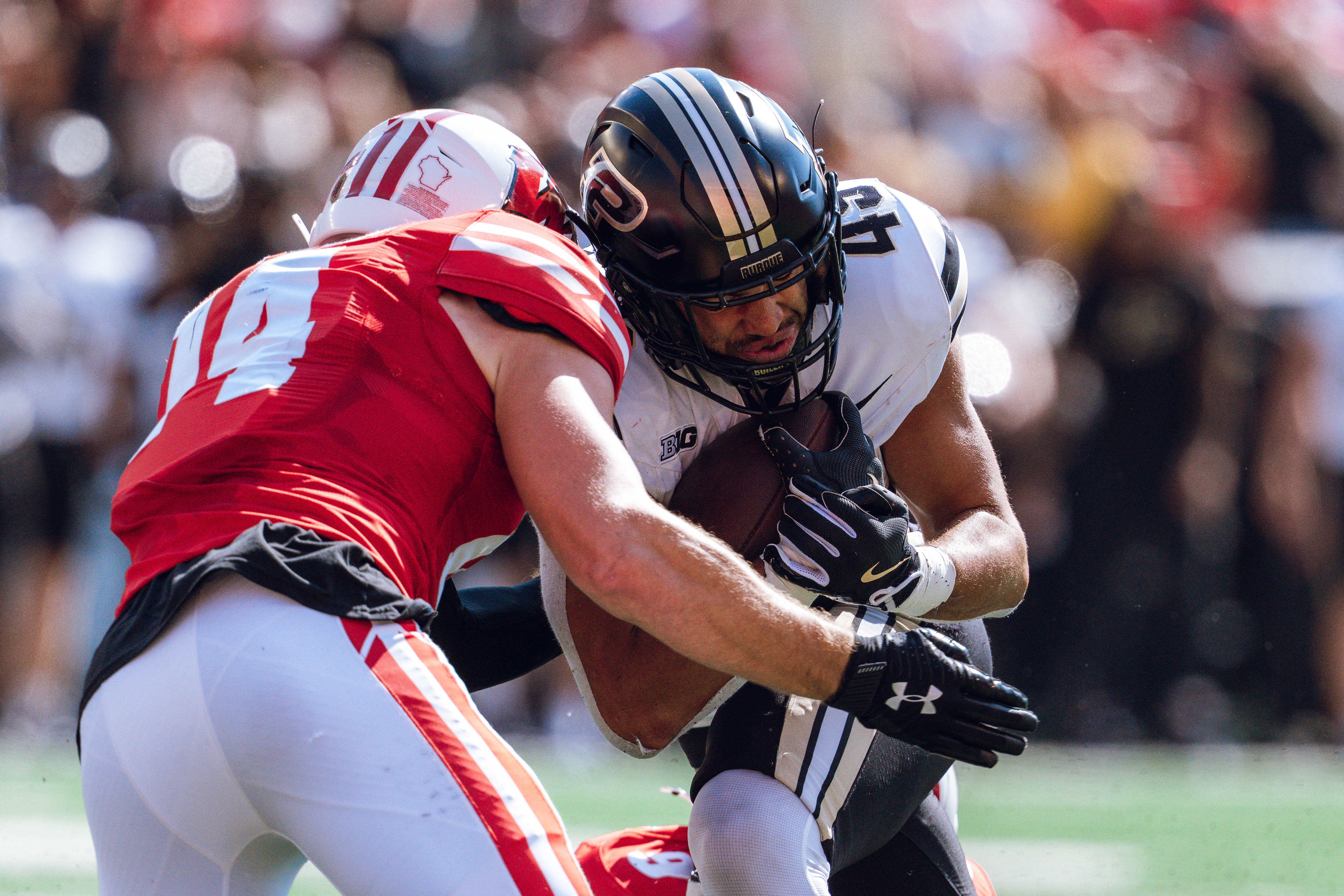 Purdue Boilermakers running back Devin Mockobee #45 runs up field after a reception against the Wisconsin Badgers at Camp Randall Stadium on October 5, 2024 in Madison, Wisconsin. Photography by Ross Harried for Second Crop Sports.