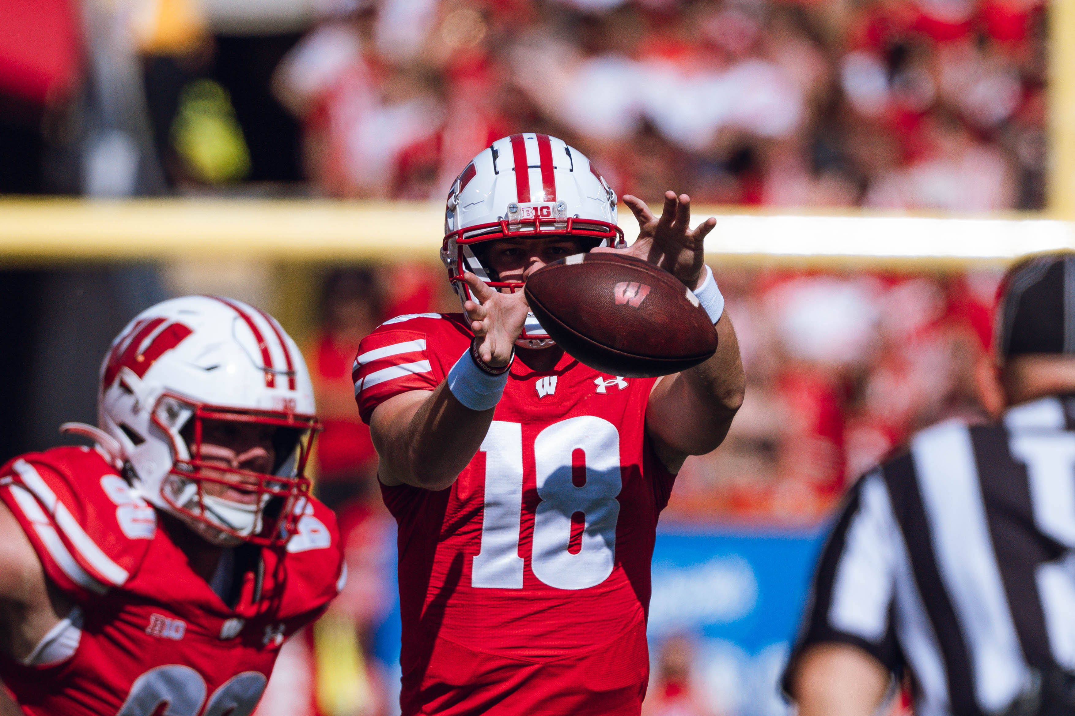 Wisconsin Badgers quarterback Braedyn Locke #18 takes a snap against the Purdue Boilermakers at Camp Randall Stadium on October 5, 2024 in Madison, Wisconsin. Photography by Ross Harried for Second Crop Sports.