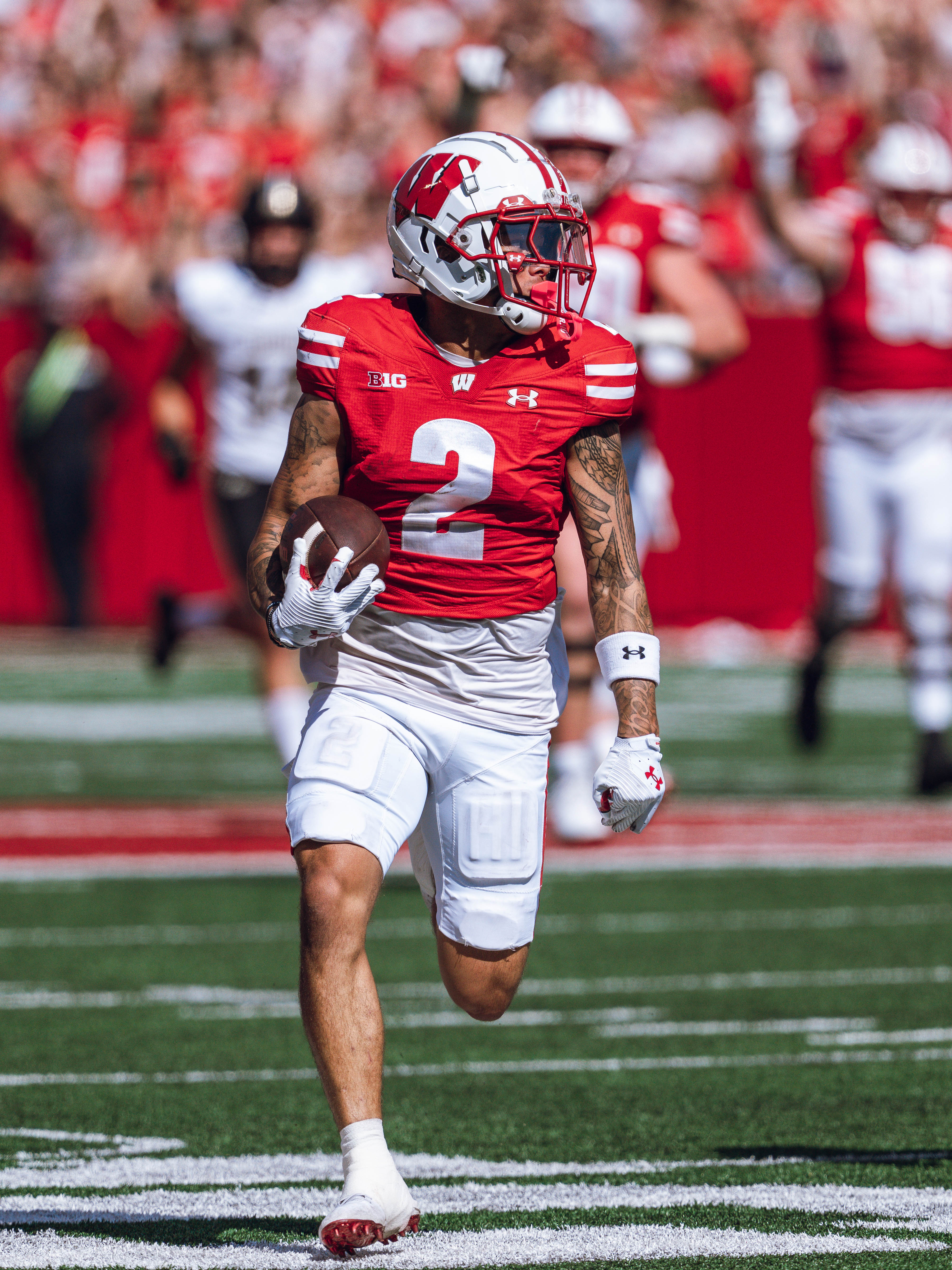 Wisconsin Badgers wide receiver Trech Kekahuna #2 outruns the Purdue Boilermakers defense for a touchdown at Camp Randall Stadium on October 5, 2024 in Madison, Wisconsin. Photography by Ross Harried for Second Crop Sports.