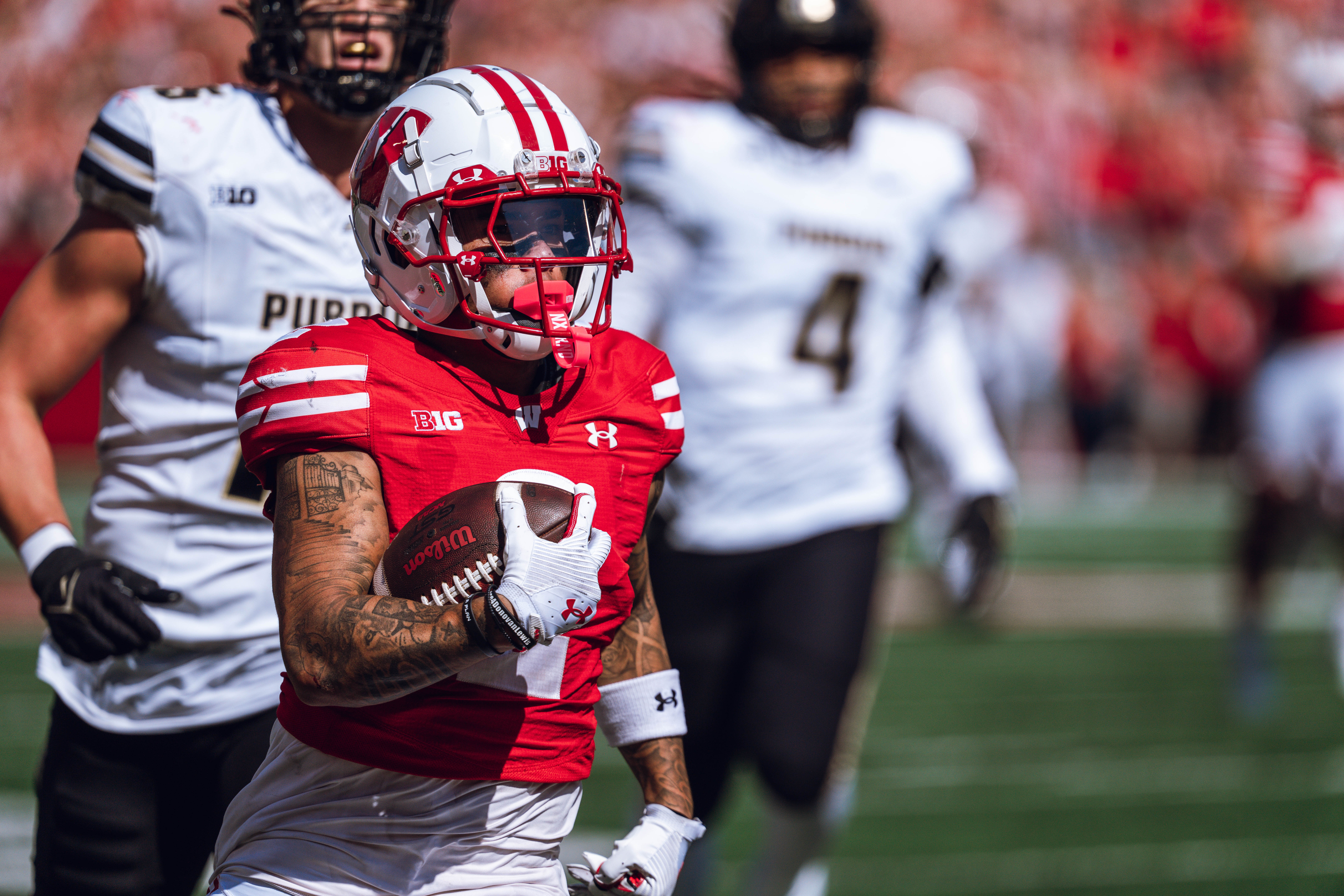 Wisconsin Badgers wide receiver Trech Kekahuna #2 outruns the Purdue Boilermakers defense for a touchdown at Camp Randall Stadium on October 5, 2024 in Madison, Wisconsin. Photography by Ross Harried for Second Crop Sports.