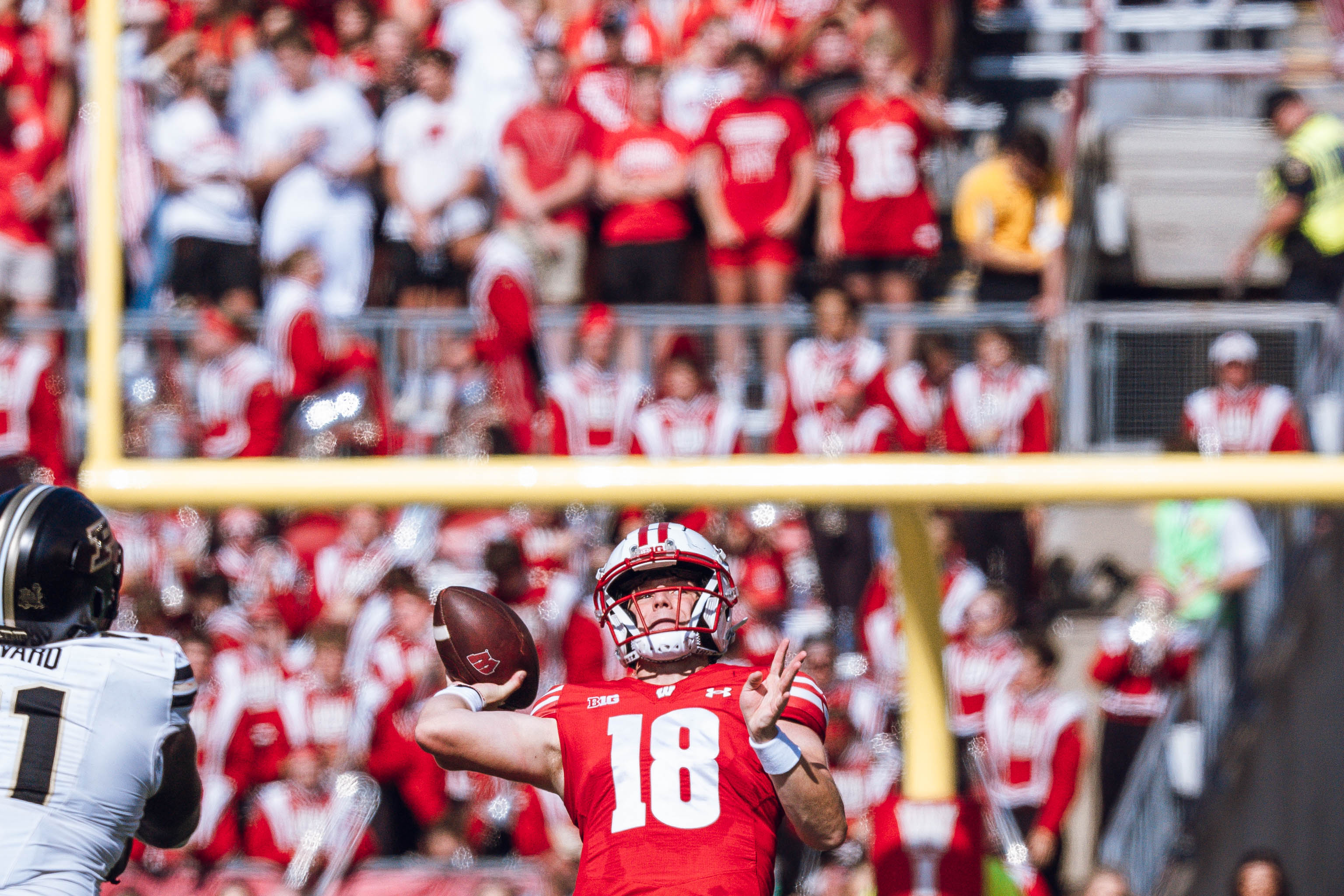 Wisconsin Badgers quarterback Braedyn Locke #18 throws a deep pass against the Purdue Boilermakers at Camp Randall Stadium on October 5, 2024 in Madison, Wisconsin. Photography by Ross Harried for Second Crop Sports.