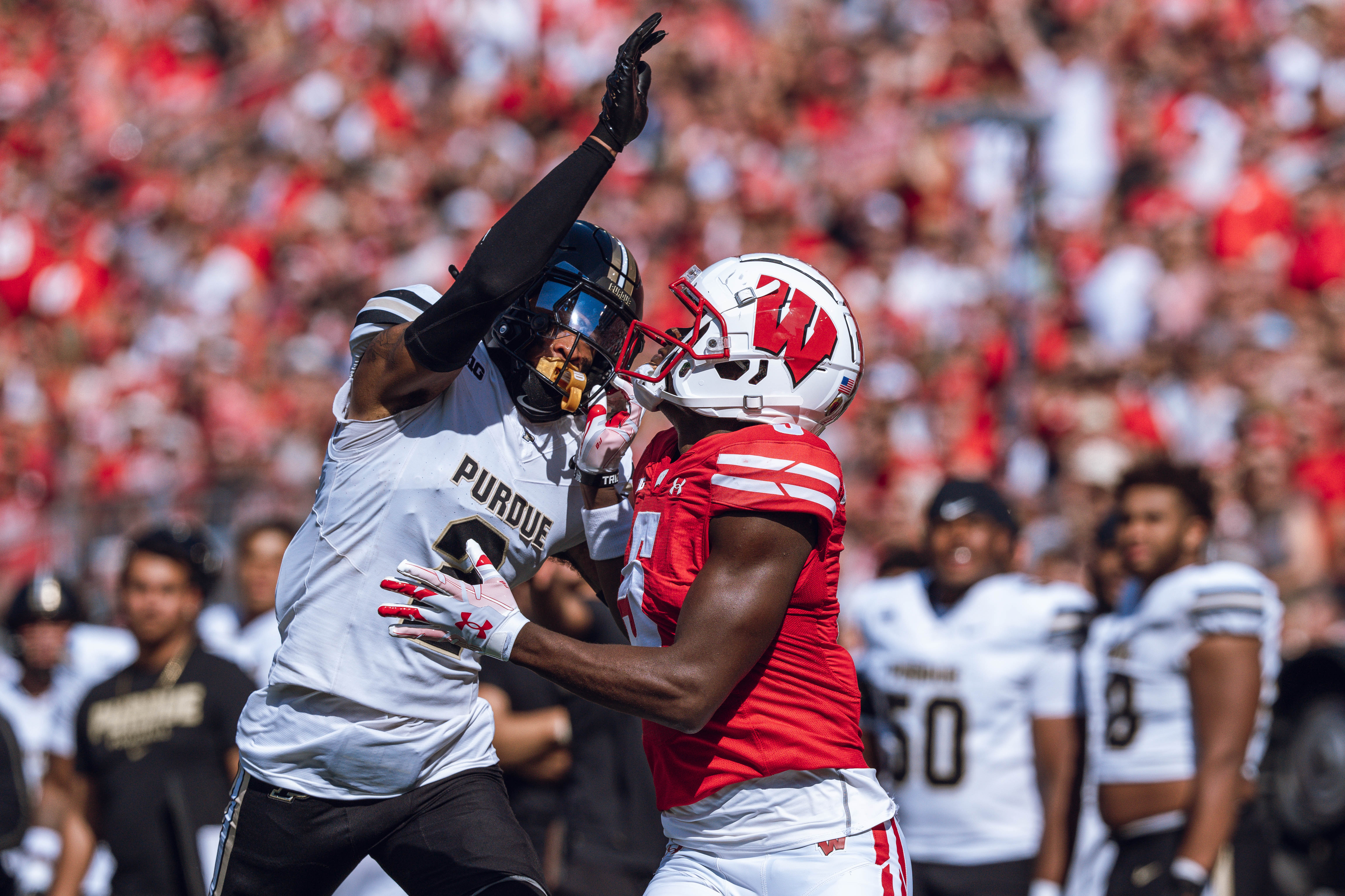 Purdue defensive back Nyland Green #2 defends Wisconsin Badgers wide receiver Quincy Burroughs #5 at Camp Randall Stadium on October 5, 2024 in Madison, Wisconsin. Photography by Ross Harried for Second Crop Sports.