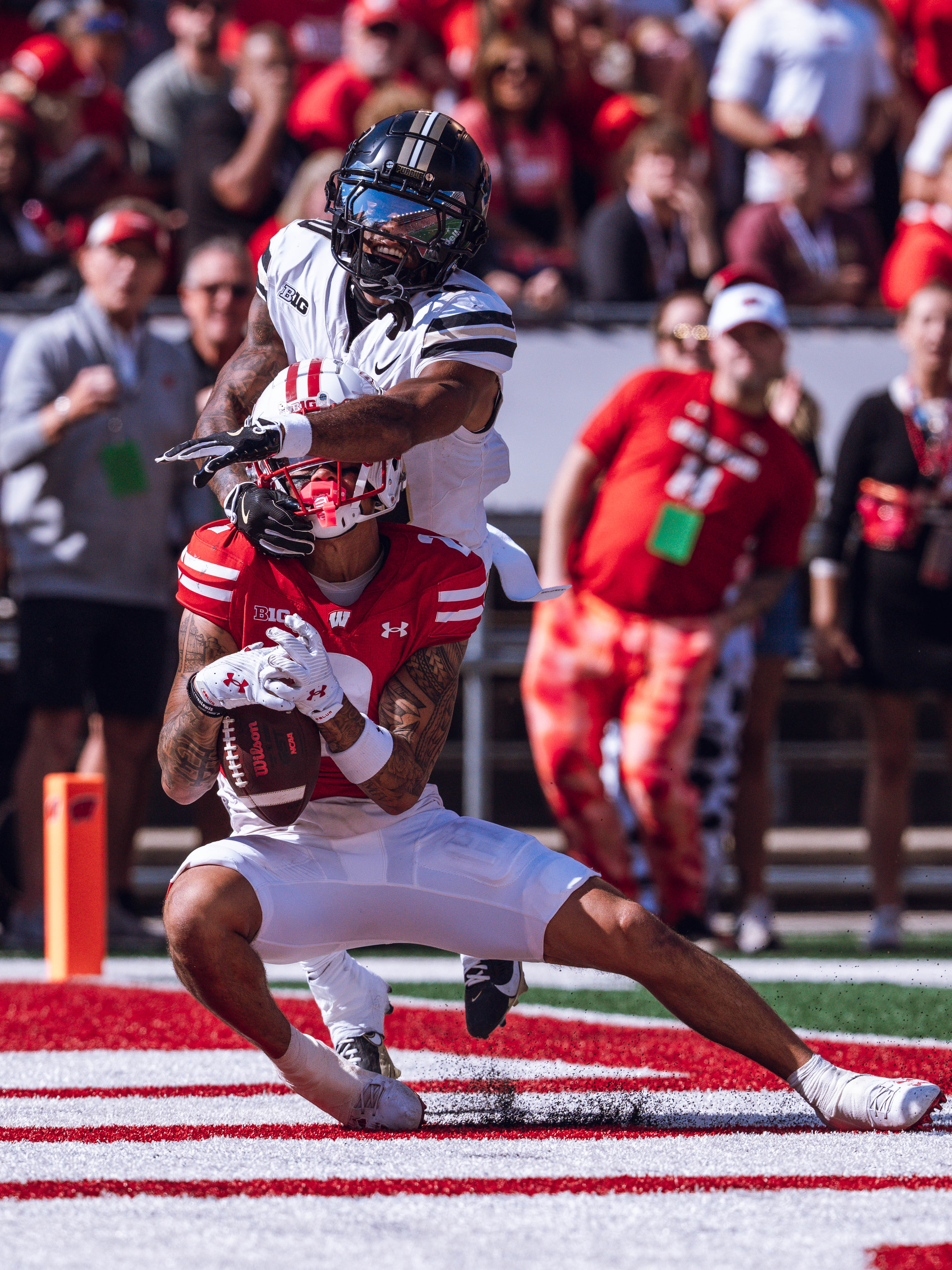 Wisconsin Badgers wide receiver Trech Kekahuna #2 hauls in a touchdown pass against the Purdue Boilermakers at Camp Randall Stadium on October 5, 2024 in Madison, Wisconsin. Photography by Ross Harried for Second Crop Sports.