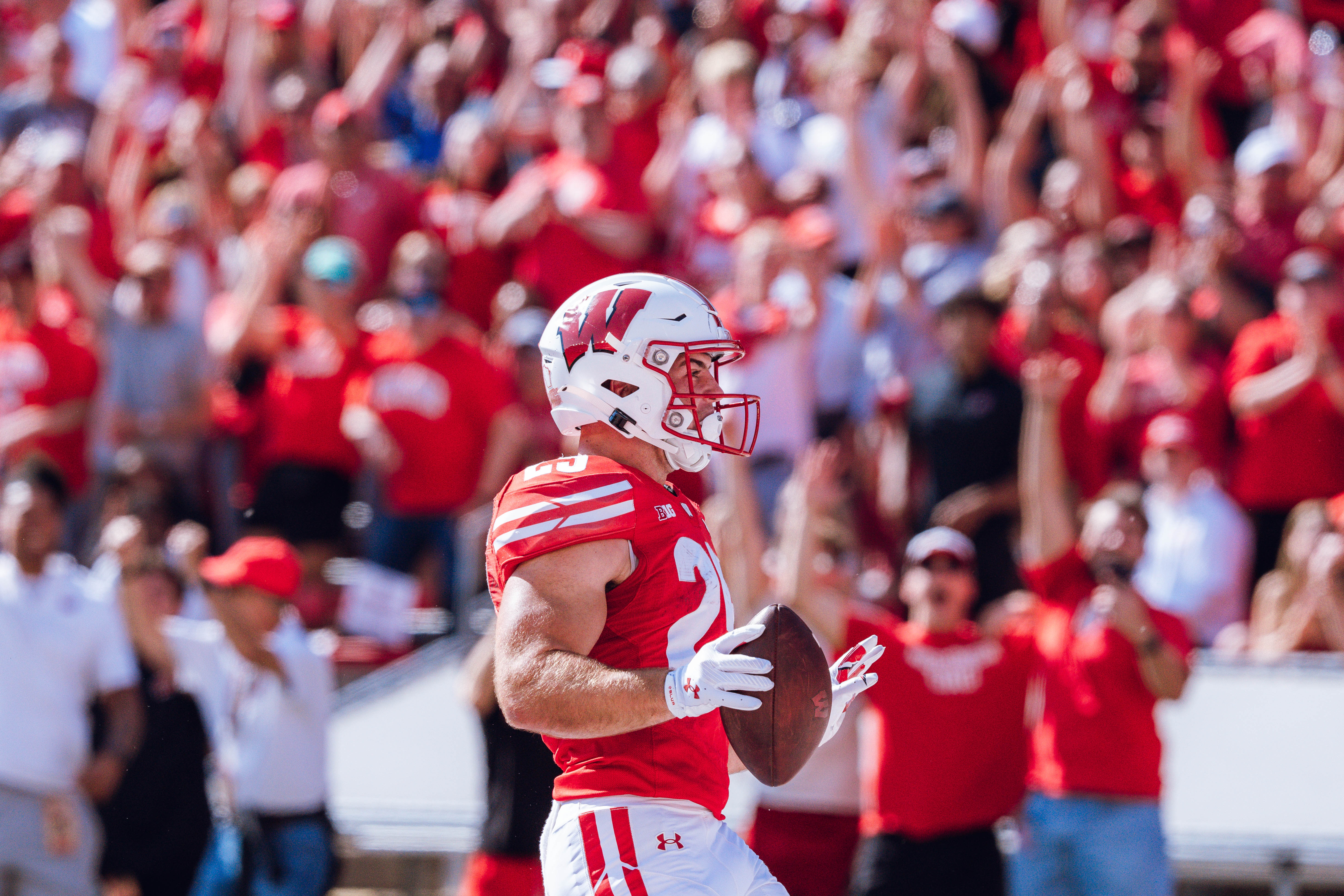 Wisconsin Badgers running back Cade Yacamelli #25 runs in a touchdown against the Purdue Boilermakers at Camp Randall Stadium on October 5, 2024 in Madison, Wisconsin. Photography by Ross Harried for Second Crop Sports.