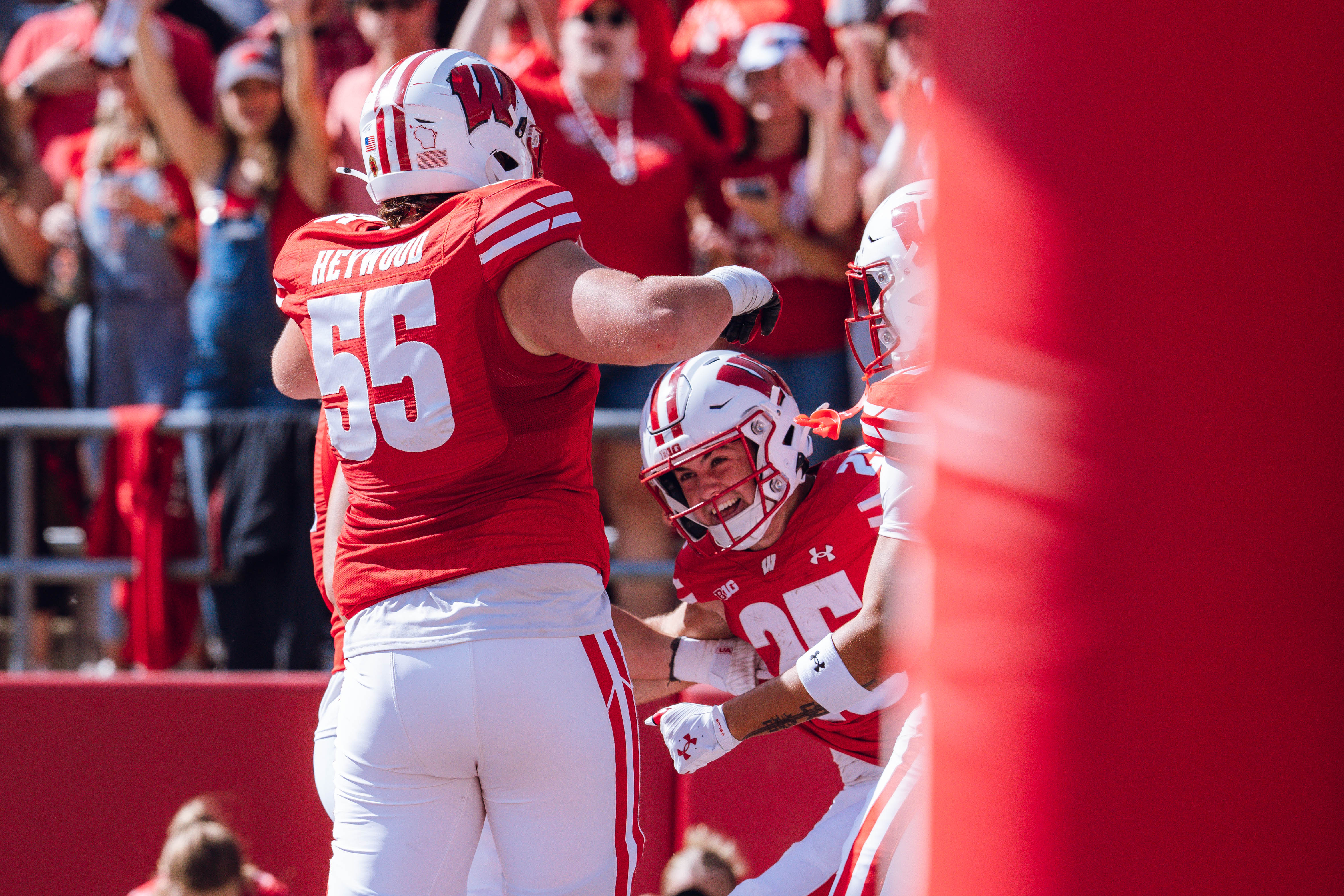 The Wisconsin Badgers celebrate a Cade Yacamelli #25 touchdown against the Purdue Boilermakers at Camp Randall Stadium on October 5, 2024 in Madison, Wisconsin. Photography by Ross Harried for Second Crop Sports.