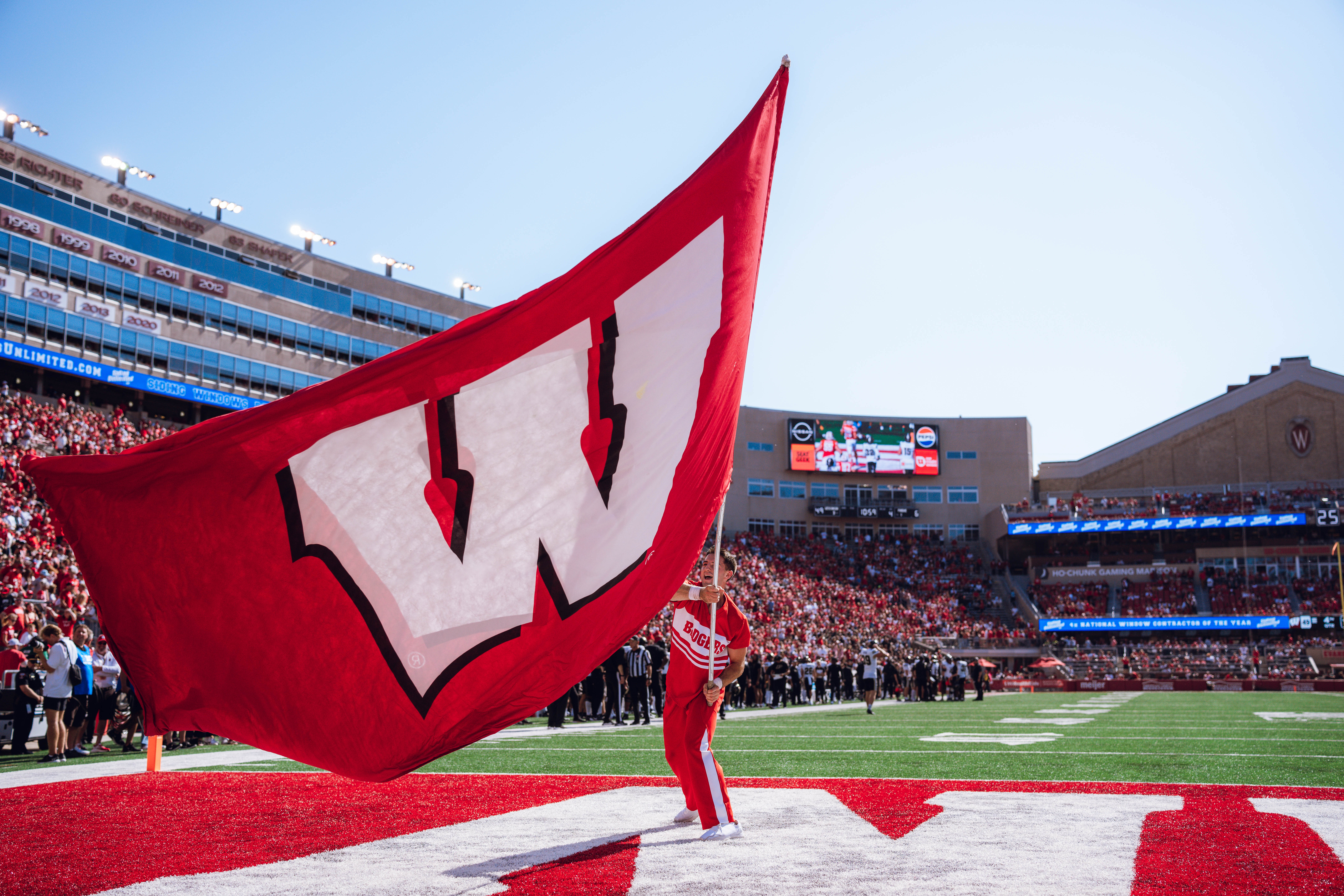 The Wisconsin Badgers celebrate a Cade Yacamelli #25 touchdown against the Purdue Boilermakers at Camp Randall Stadium on October 5, 2024 in Madison, Wisconsin. Photography by Ross Harried for Second Crop Sports.