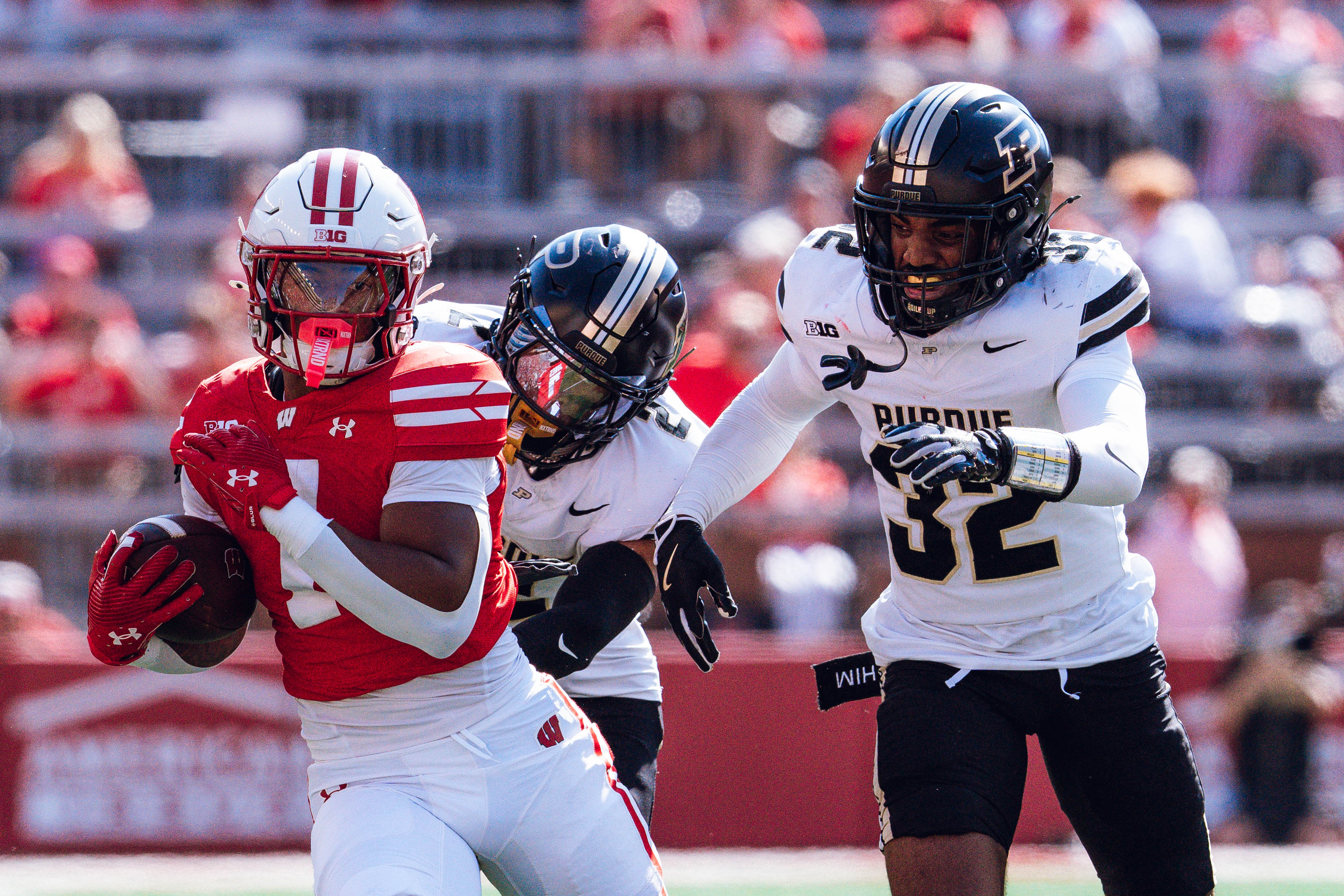 Wisconsin Badgers running back Dilin Jones #7 runs the ball against the Purdue Boilermakers at Camp Randall Stadium on October 5, 2024 in Madison, Wisconsin. Photography by Ross Harried for Second Crop Sports.