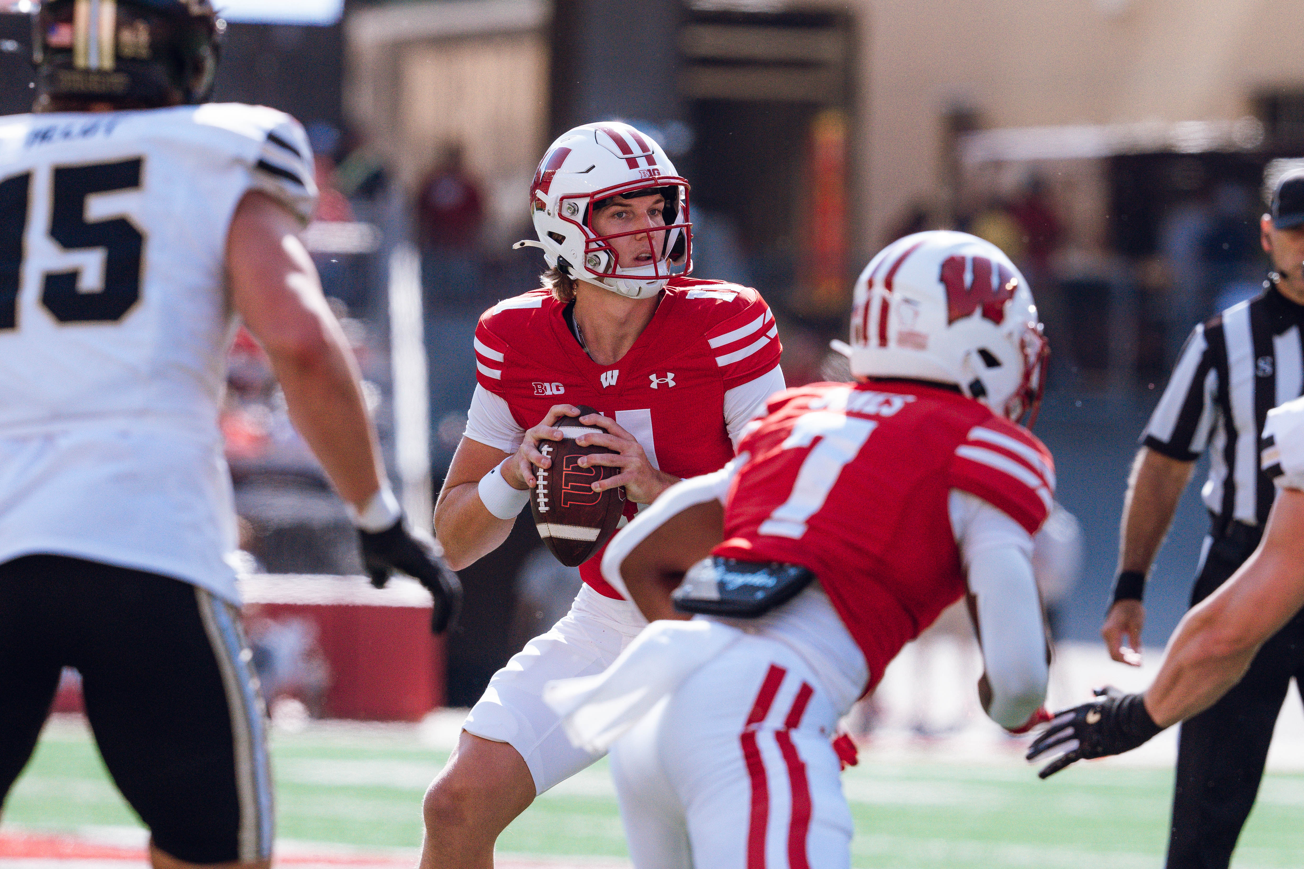 Wisconsin Badgers quarterback Mabrey Mettauer #11 looks to pass against the Purdue Boilermakers at Camp Randall Stadium on October 5, 2024 in Madison, Wisconsin. Photography by Ross Harried for Second Crop Sports.