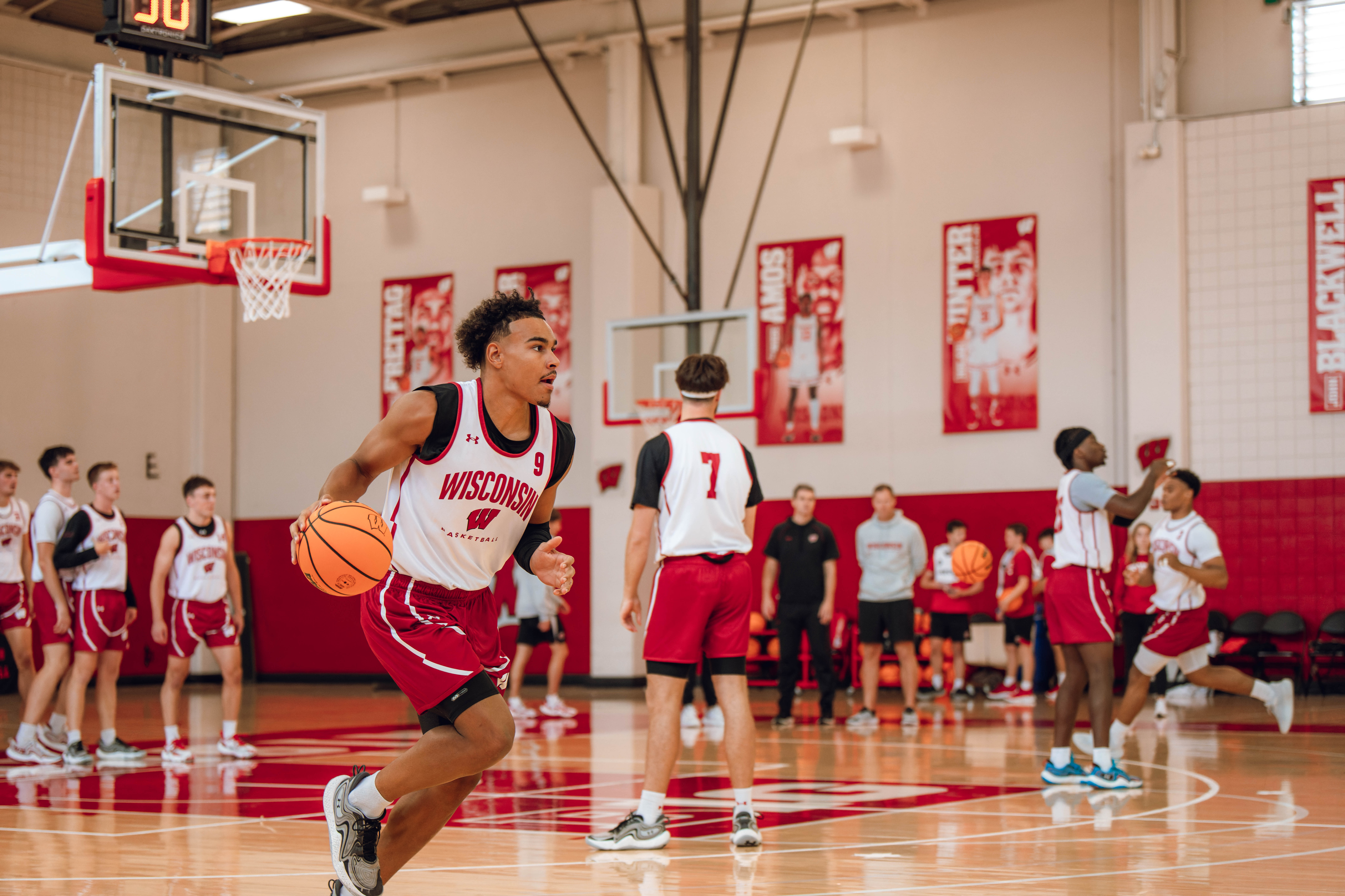 Wisconsin Badgers guard John Tonje #9 runs a drill during practice at the Nicholas Johnson Pavilion on October 7, 2024 in Madison, WI. Photography by Ross Harried for Second Crop Sports.