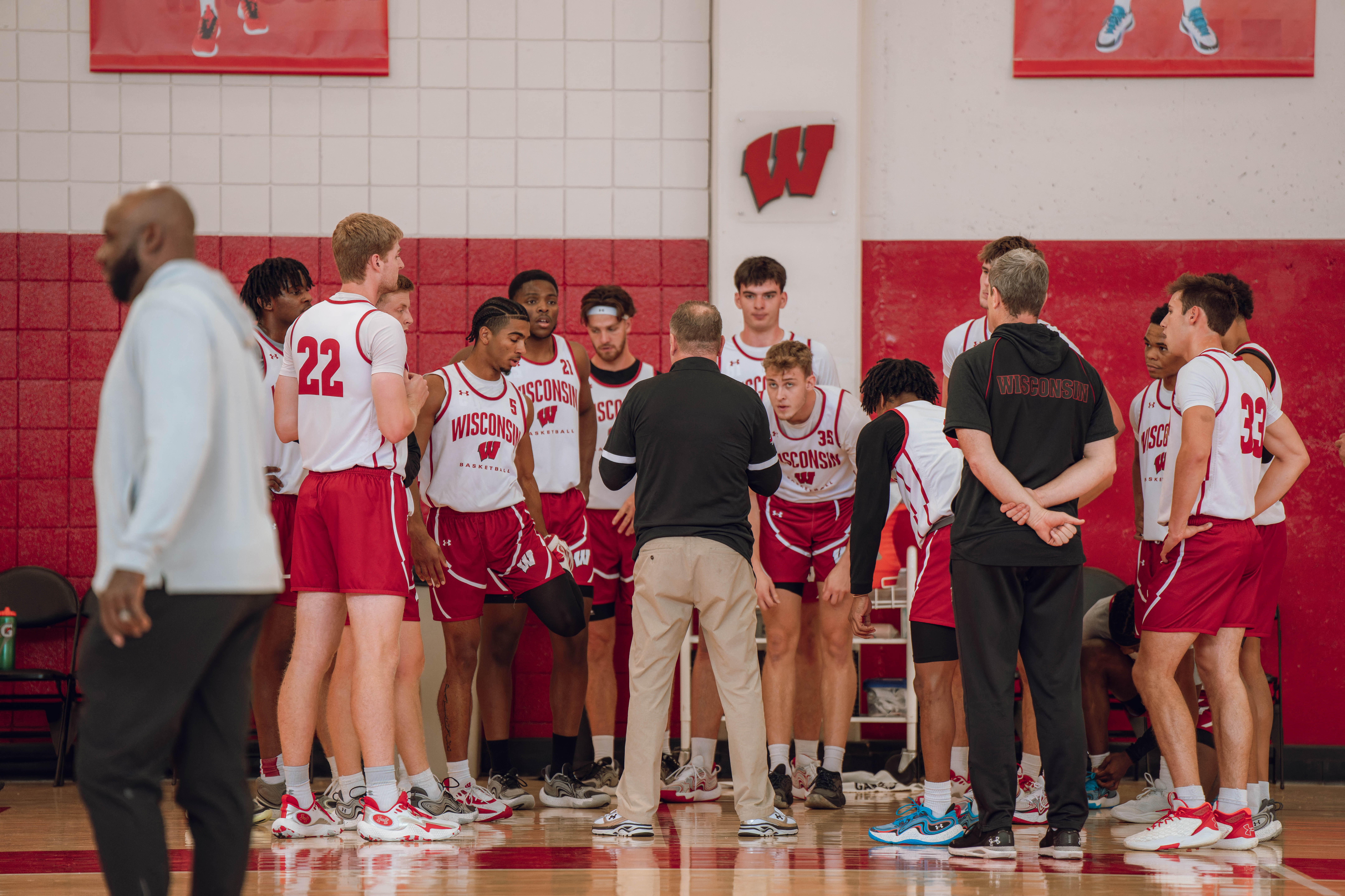 Wisconsin Badgers Head Coach Greg Gard addresses his team during practice at the Nicholas Johnson Pavilion on October 7, 2024 in Madison, WI. Photography by Ross Harried for Second Crop Sports.