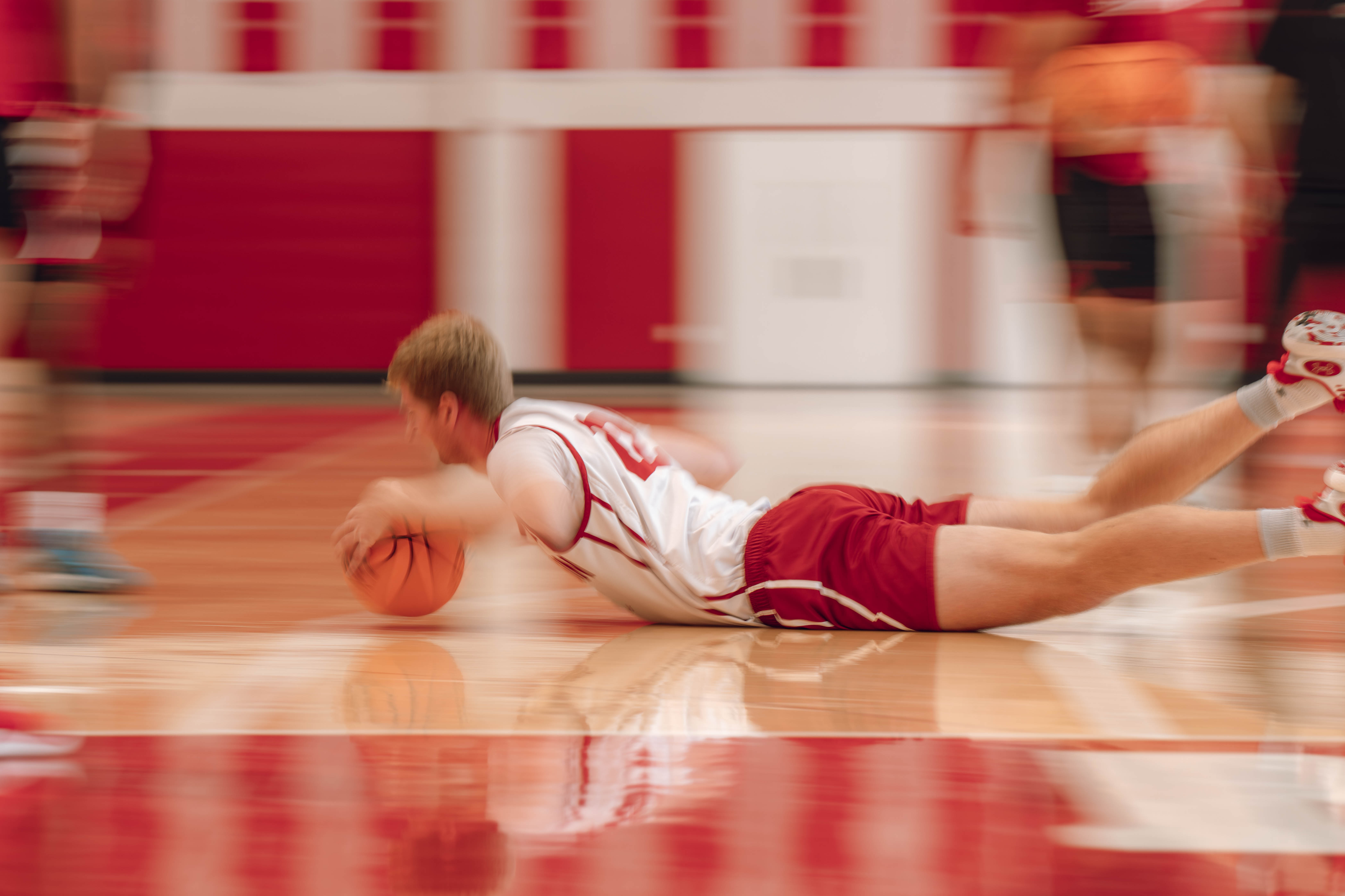 Wisconsin Badgers forward Steven Crowl #22 dives for a loose ball during practice at the Nicholas Johnson Pavilion on October 7, 2024 in Madison, WI. Photography by Ross Harried for Second Crop Sports.