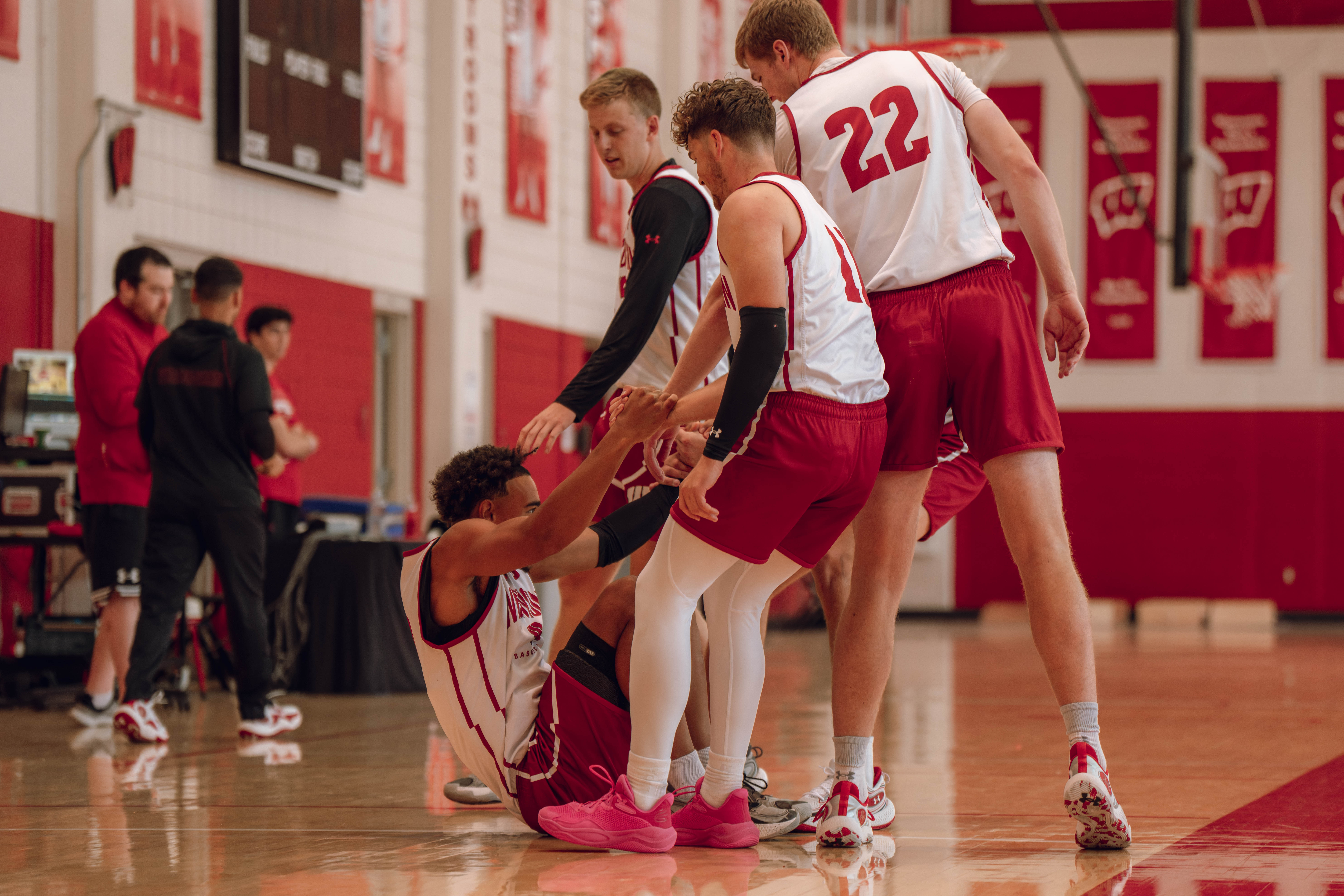 Wisconsin Badgers forward Steven Crowl #22 and guard Max Klesmit #11 help guard John Tonje #9 up off the floor during practice at the Nicholas Johnson Pavilion on October 7, 2024 in Madison, WI. Photography by Ross Harried for Second Crop Sports.