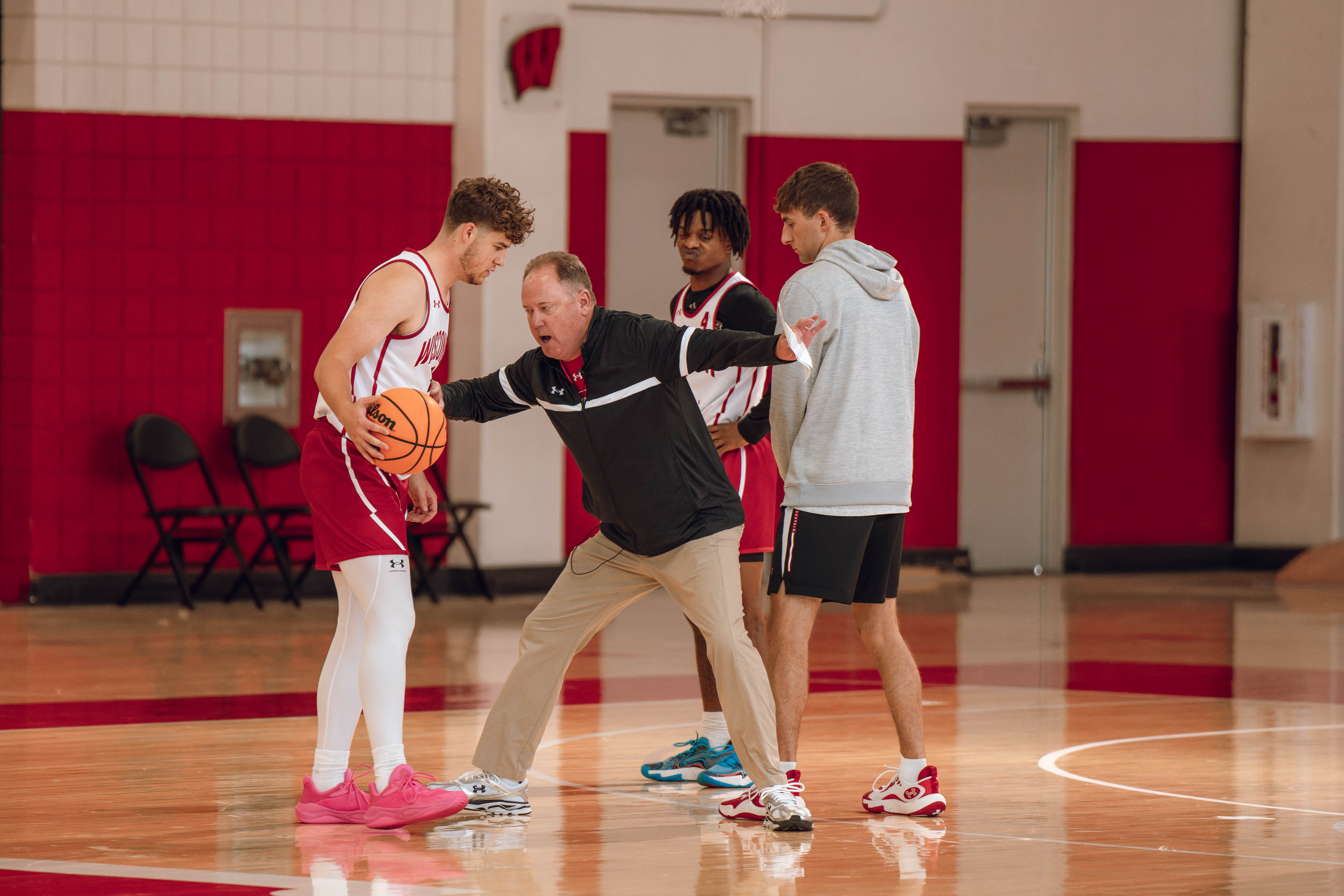 Wisconsin Badgers Head Coach Greg Gard works with guard Max Klesmit #11 during practice at the Nicholas Johnson Pavilion on October 7, 2024 in Madison, WI. Photography by Ross Harried for Second Crop Sports.