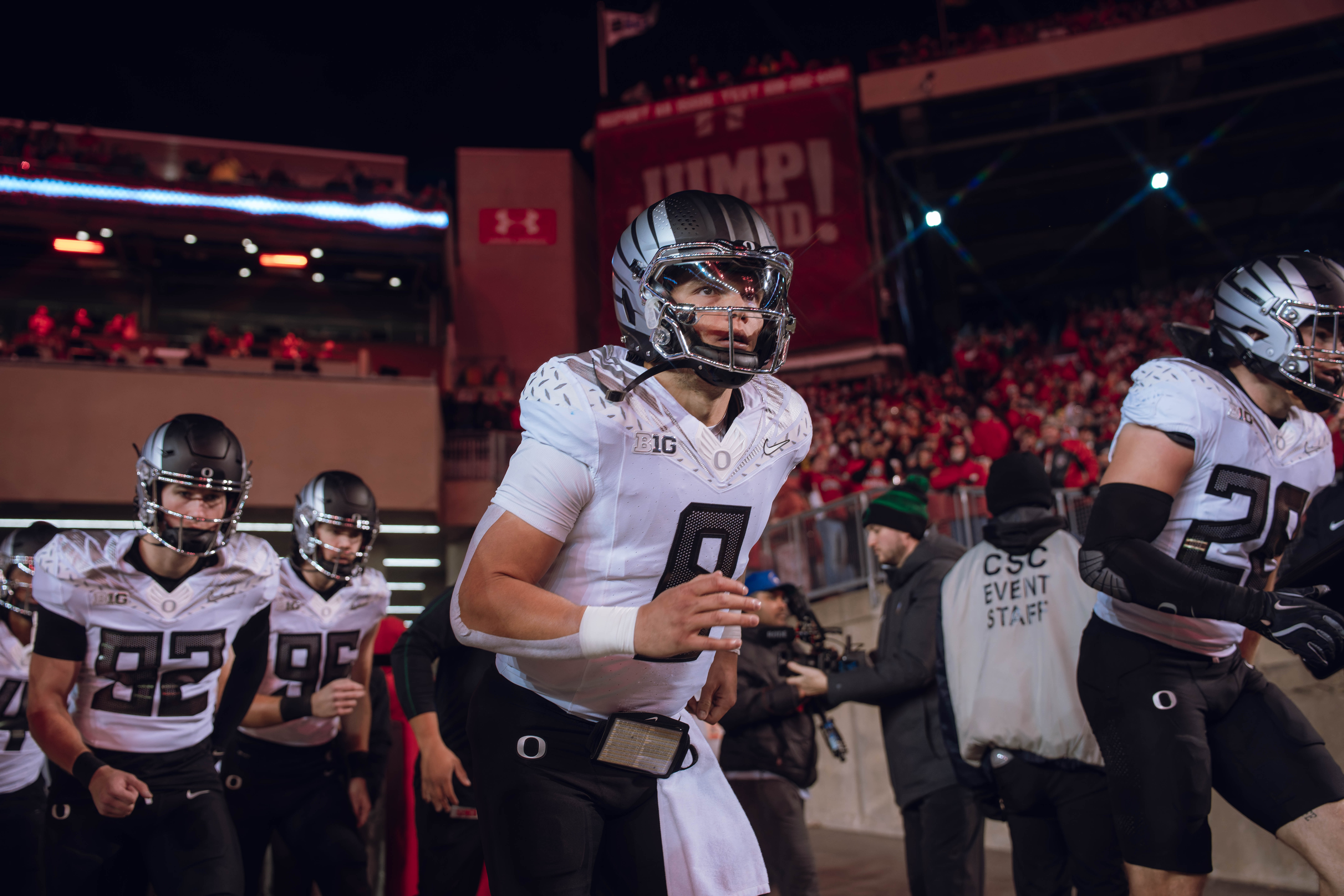 Oregon quarterback Dillon Gabriel #8 leads the Oregon Ducks out of the tunnel at Camp Randall Stadium as they take on the Wisconsin Badgers on November 16, 2024 in Madison, Wisconsin. Photography by Ross Harried for Second Crop Sports.