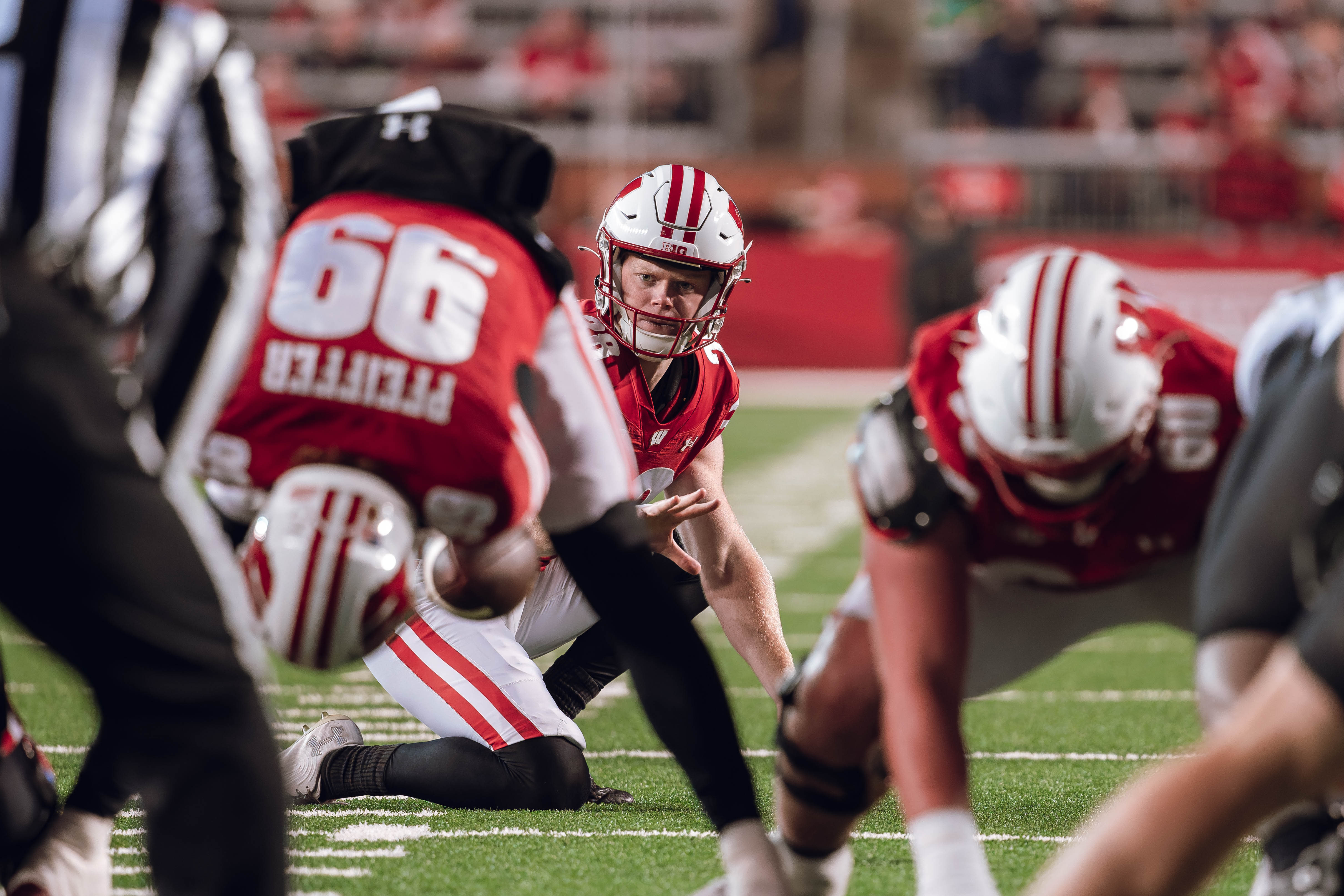 Wisconsin Badgers punter Gavin Meyers #28 gets ready to hold a kick against Oregon Ducks at Camp Randall Stadium on November 16, 2024 in Madison, Wisconsin. Photography by Ross Harried for Second Crop Sports.