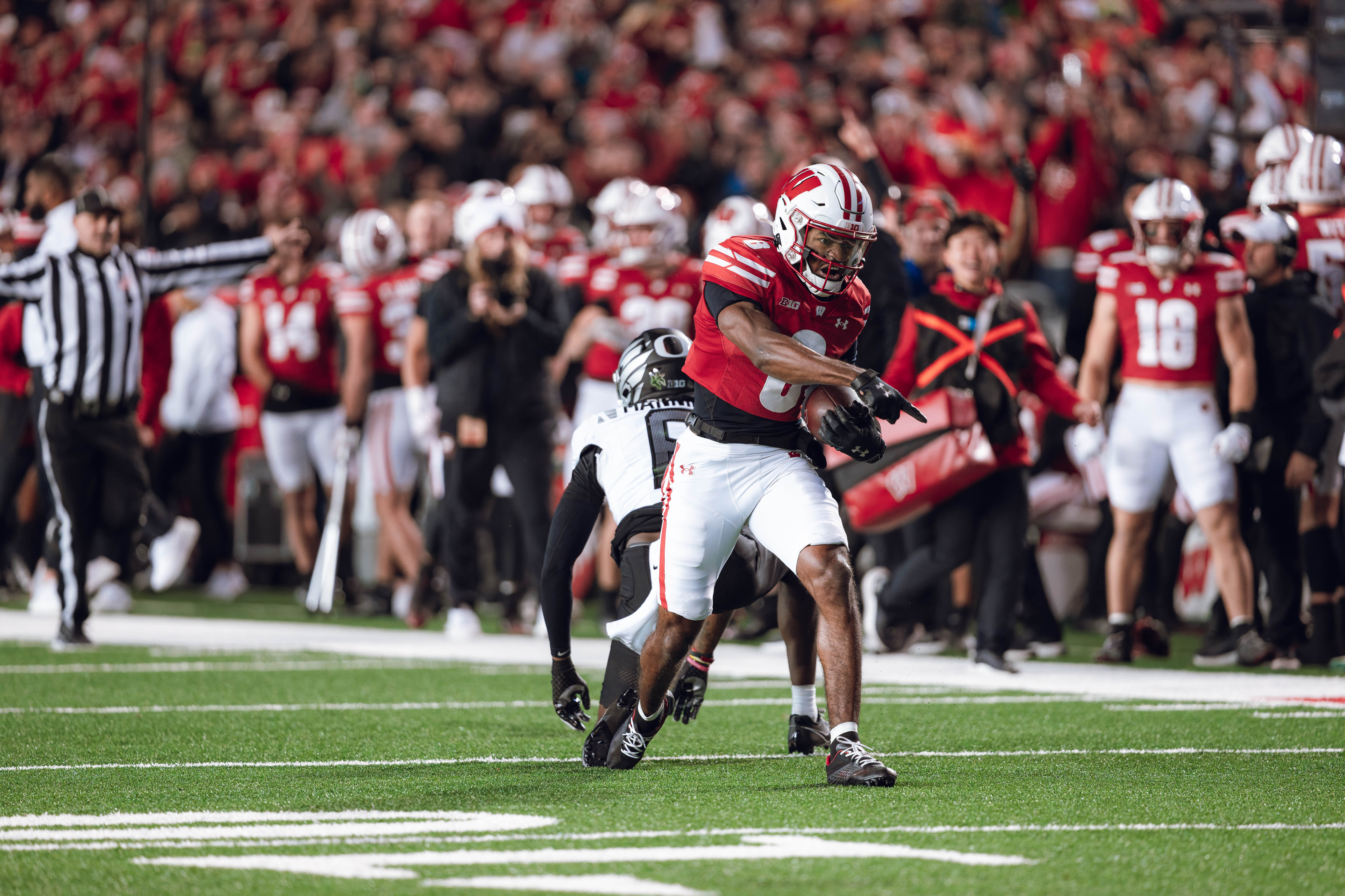 Wisconsin Badgers wide receiver Vinny Anthony II #8 hauls in a long pass against the Oregon Ducks at Camp Randall Stadium on November 16, 2024 in Madison, Wisconsin. Photography by Ross Harried for Second Crop Sports.