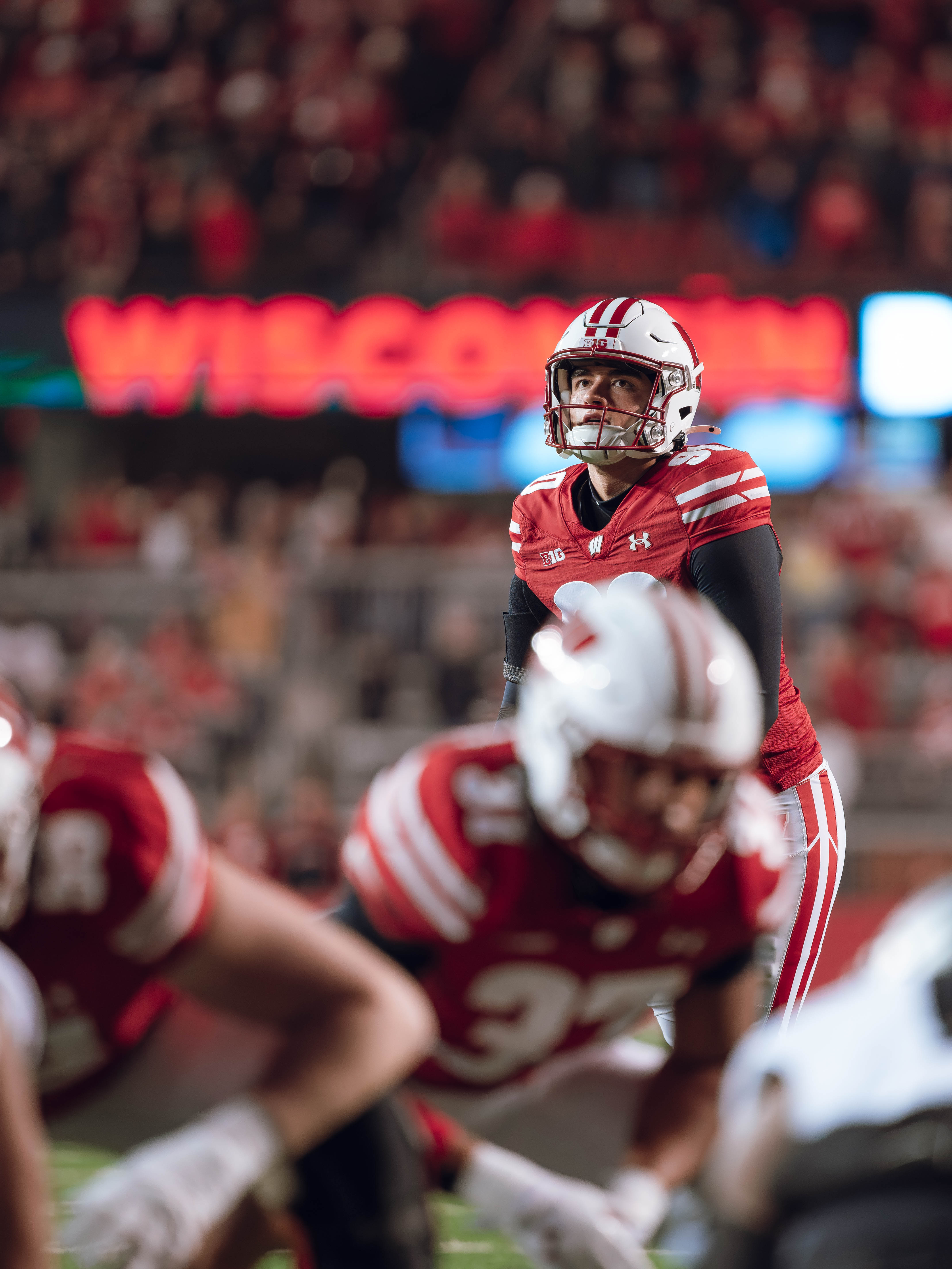 Wisconsin Badgers kicker Nathanial Vakos #90 looks up the the goalpost before kicking an extra point against the Oregon Ducks at Camp Randall Stadium on November 16, 2024 in Madison, Wisconsin. Photography by Ross Harried for Second Crop Sports.