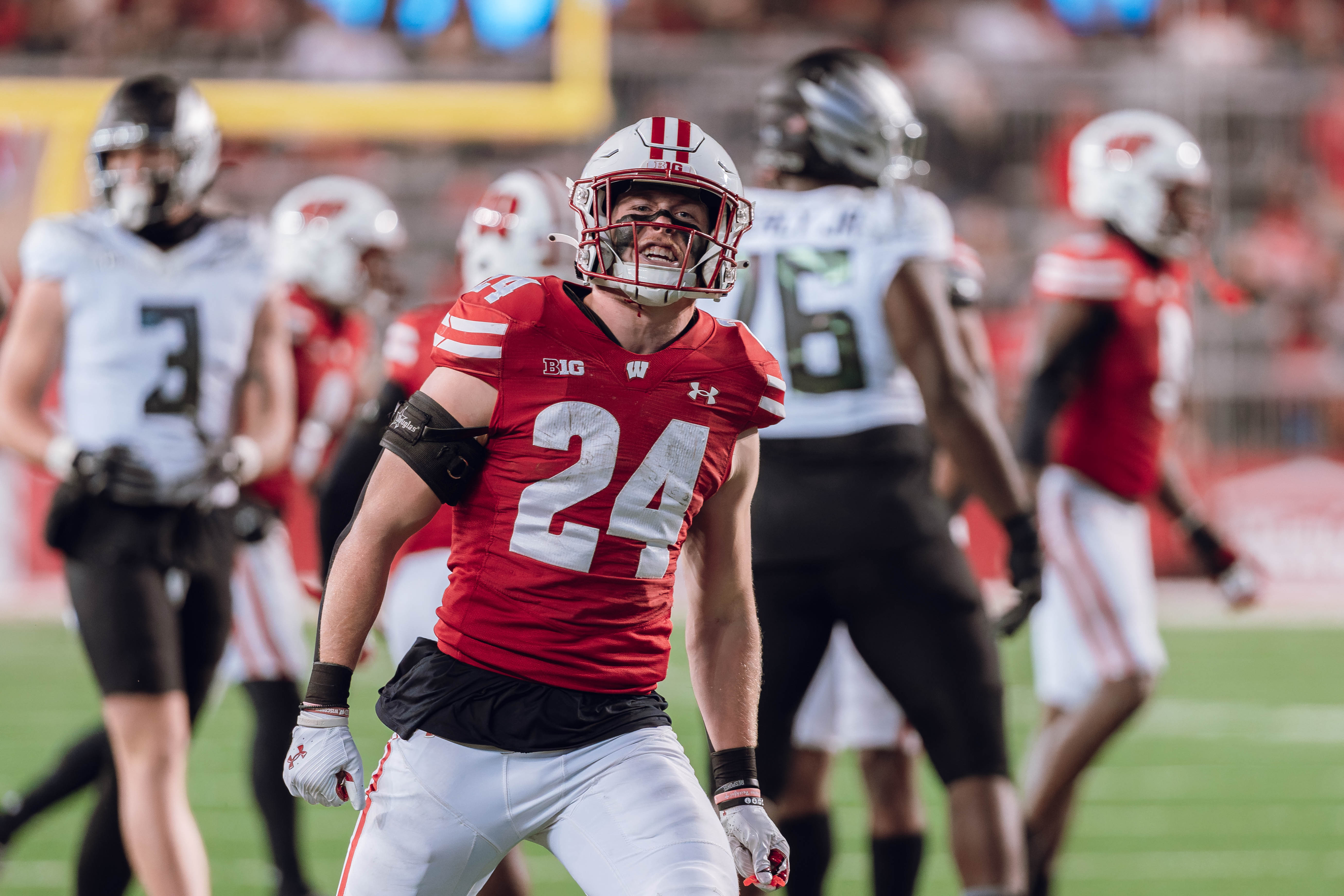 Wisconsin Badgers safety Hunter Wohler #24 celebrates a defensive stop against the Oregon Ducks at Camp Randall Stadium on November 16, 2024 in Madison, Wisconsin. Photography by Ross Harried for Second Crop Sports.