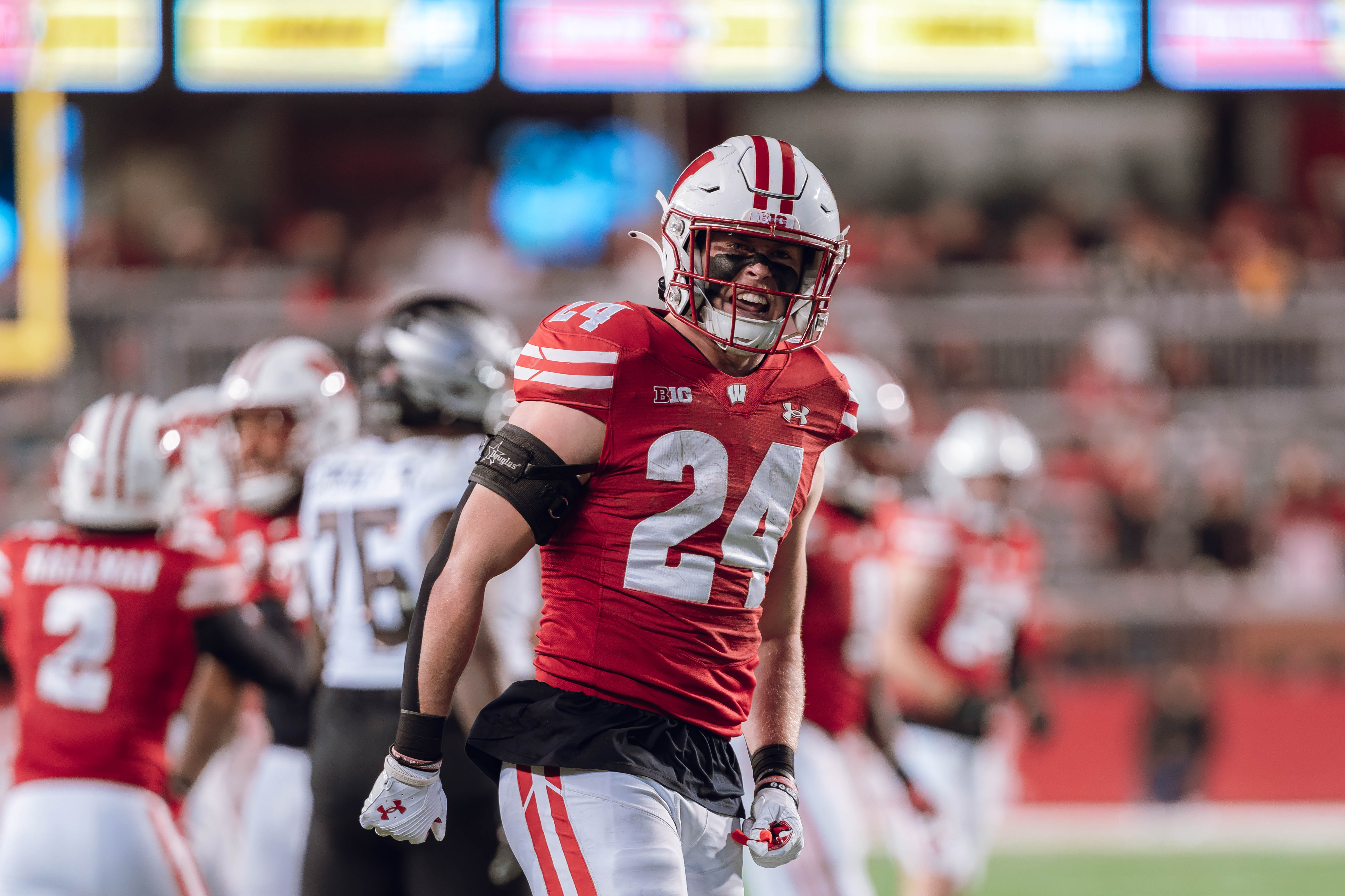 Wisconsin Badgers safety Hunter Wohler #24 celebrates a defensive stop against the Oregon Ducks at Camp Randall Stadium on November 16, 2024 in Madison, Wisconsin. Photography by Ross Harried for Second Crop Sports.