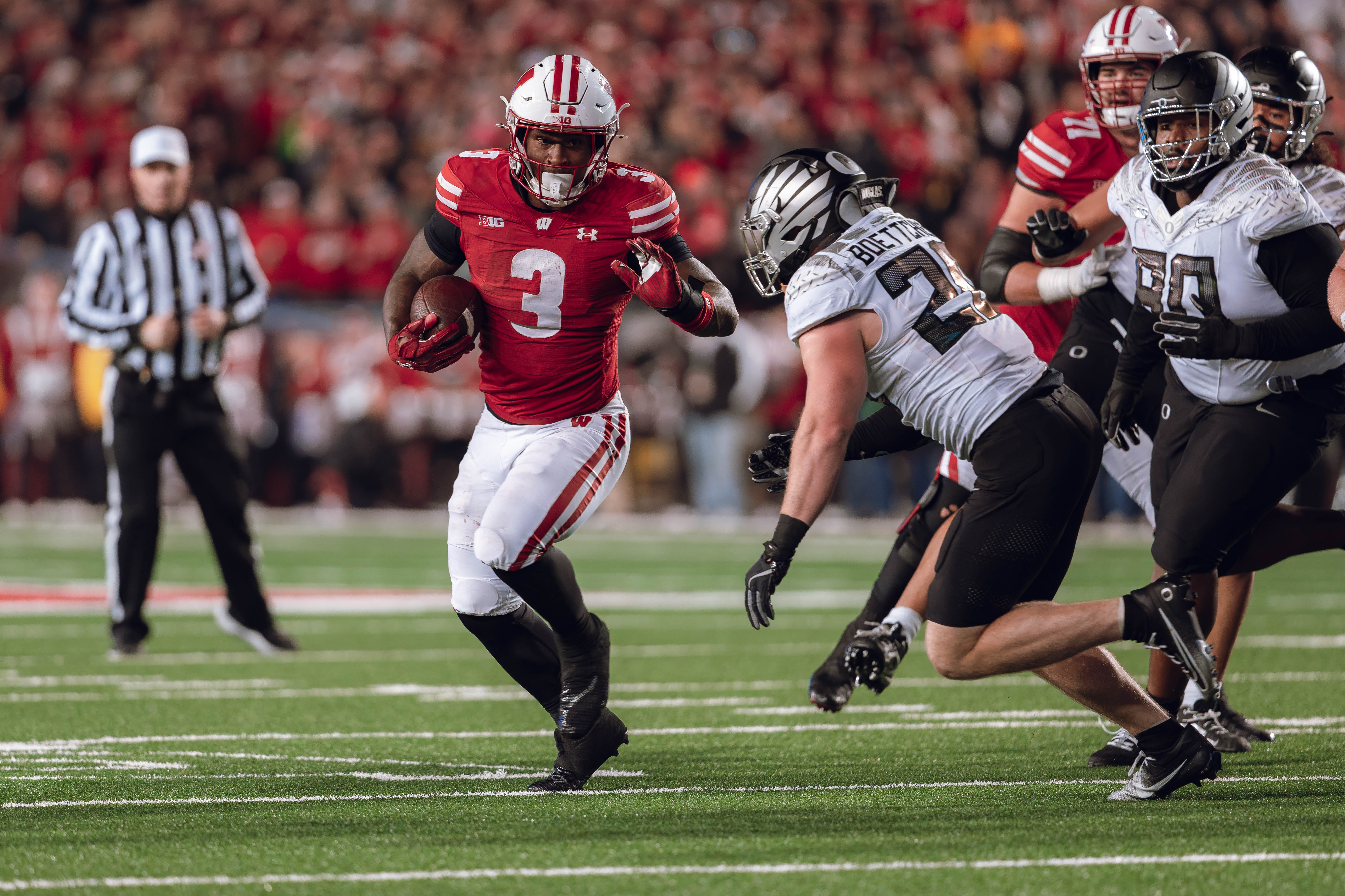 Wisconsin Badgers running back Tawee Walker #3 finds the hole against the Oregon Ducks defense at Camp Randall Stadium on November 16, 2024 in Madison, Wisconsin. Photography by Ross Harried for Second Crop Sports.