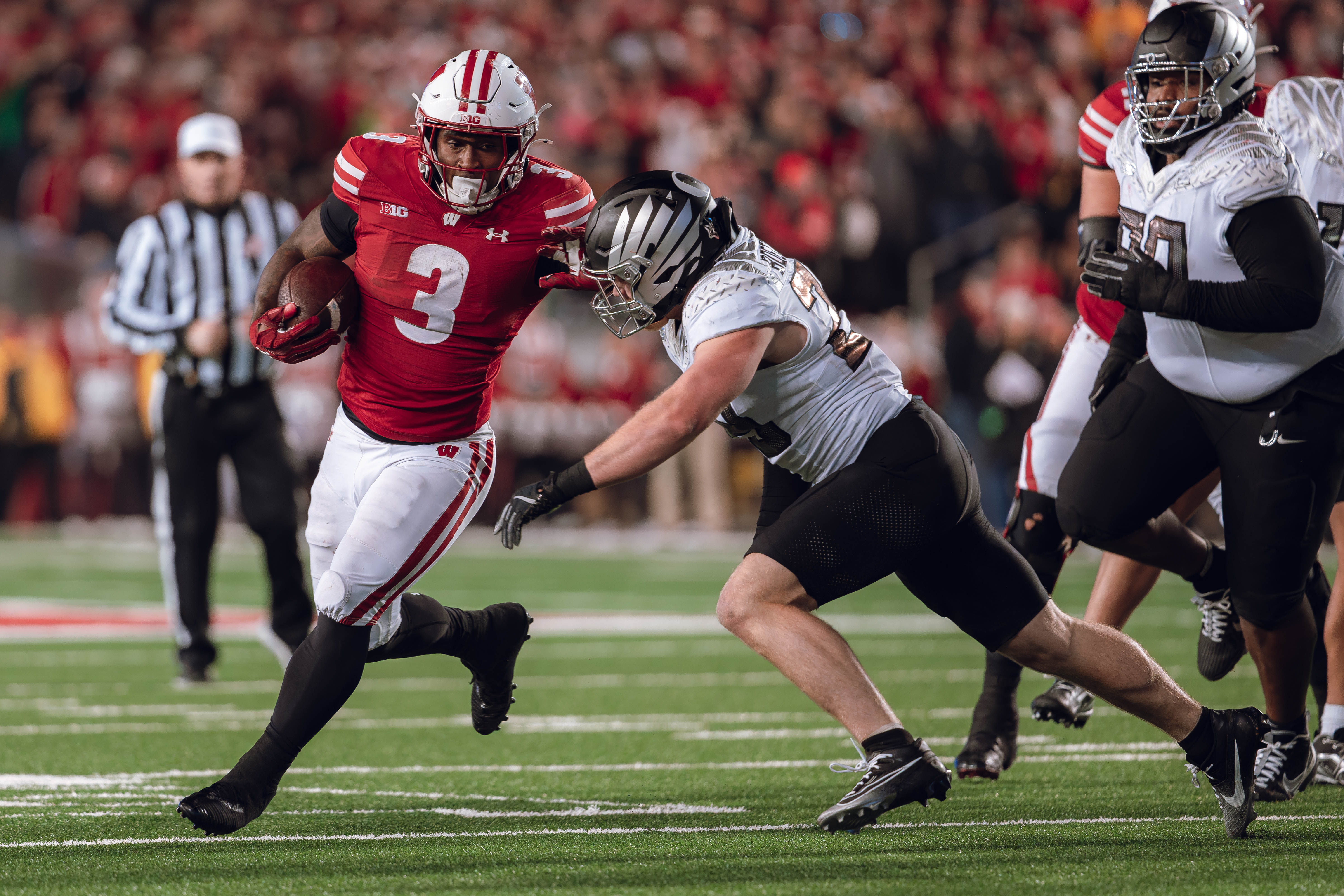 Wisconsin Badgers running back Tawee Walker #3 finds the hole against the Oregon Ducks defense at Camp Randall Stadium on November 16, 2024 in Madison, Wisconsin. Photography by Ross Harried for Second Crop Sports.