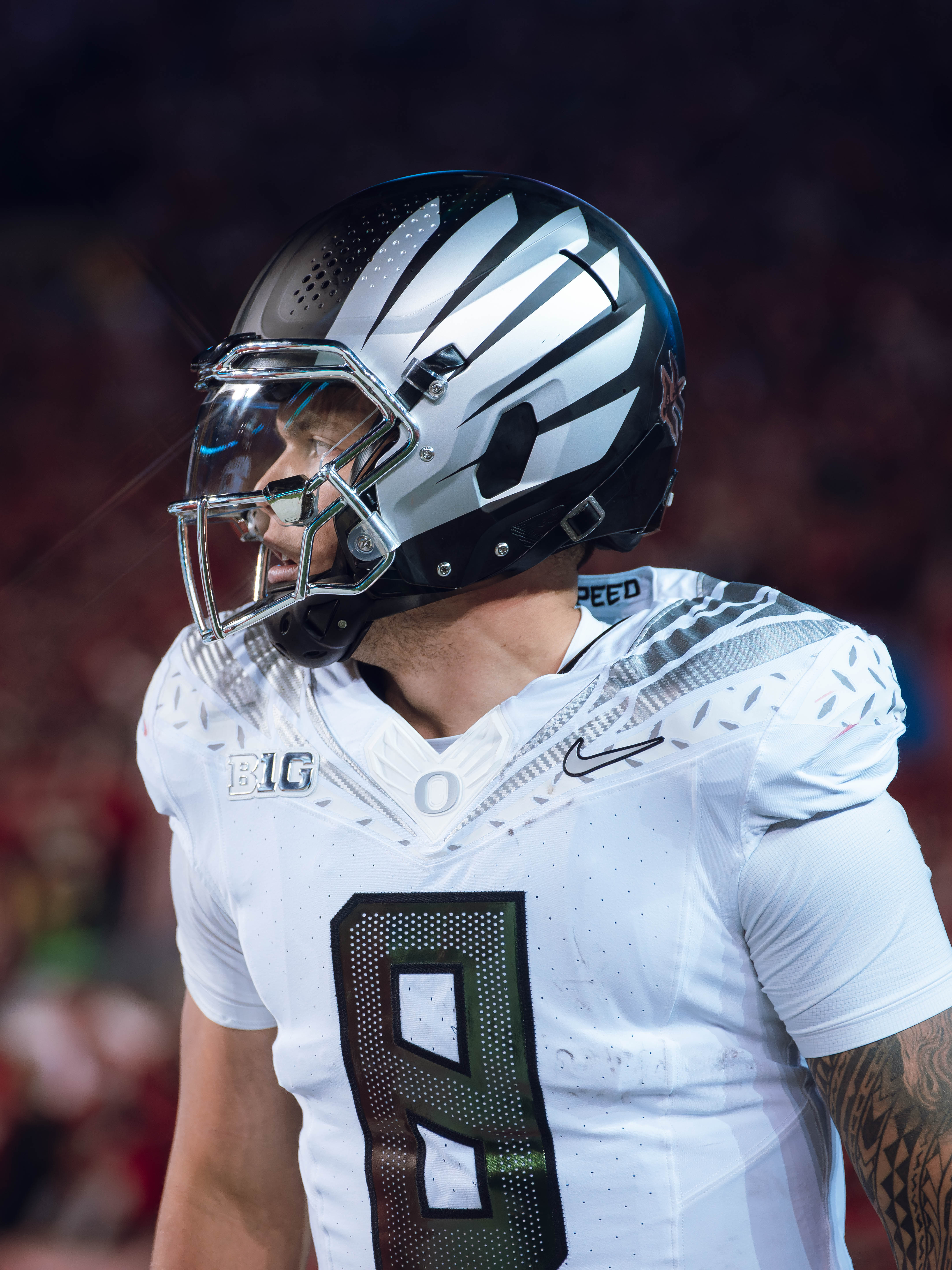 Oregon quarterback Dillon Gabriel #8 heads back the sideline after a touchdown against the Wisconsin Badgers at Camp Randall Stadium on November 16, 2024 in Madison, Wisconsin. Photography by Ross Harried for Second Crop Sports.