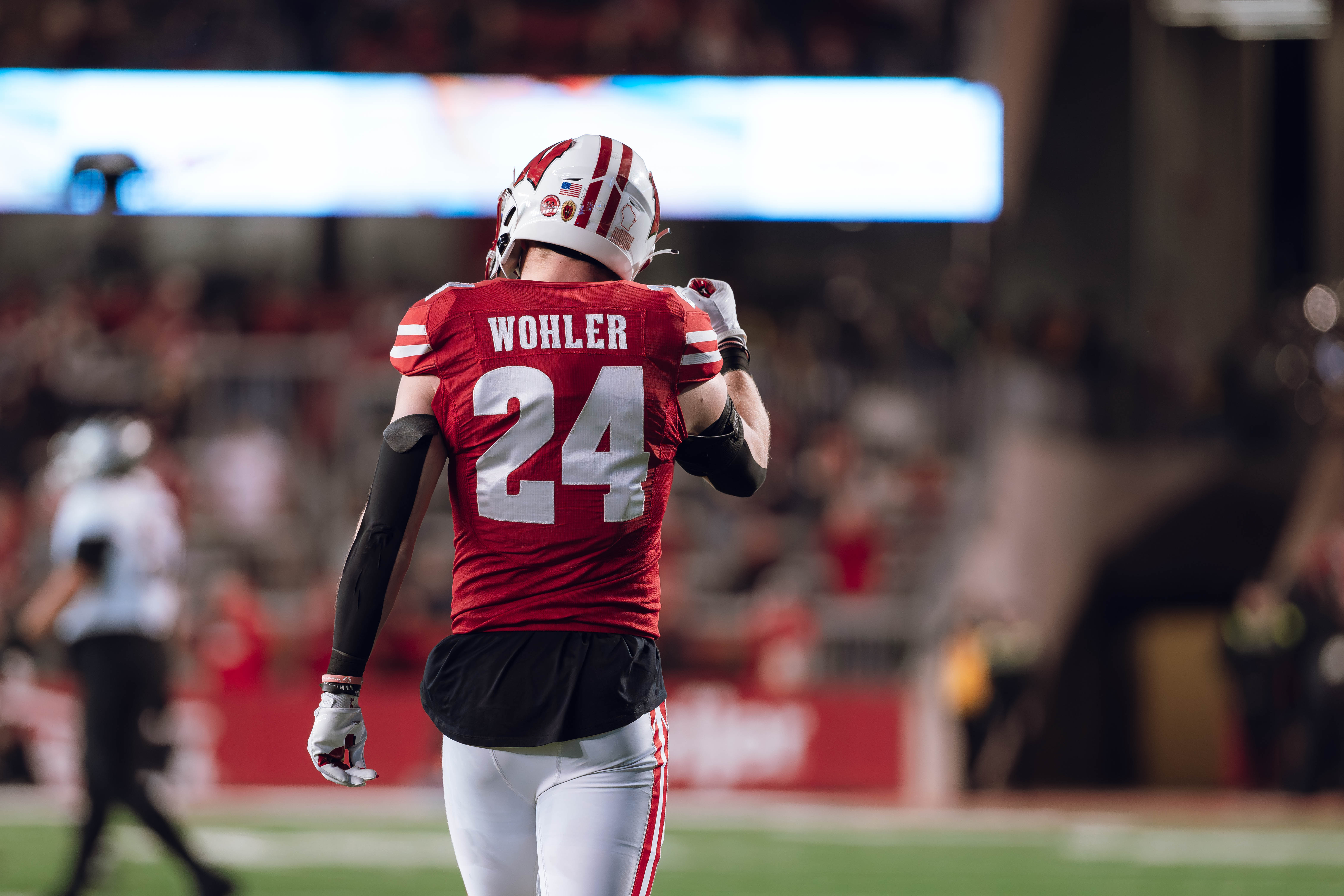 Wisconsin Badgers safety Hunter Wohler #24 celebrates a defensive stop against the Oregon Ducks at Camp Randall Stadium on November 16, 2024 in Madison, Wisconsin. Photography by Ross Harried for Second Crop Sports.