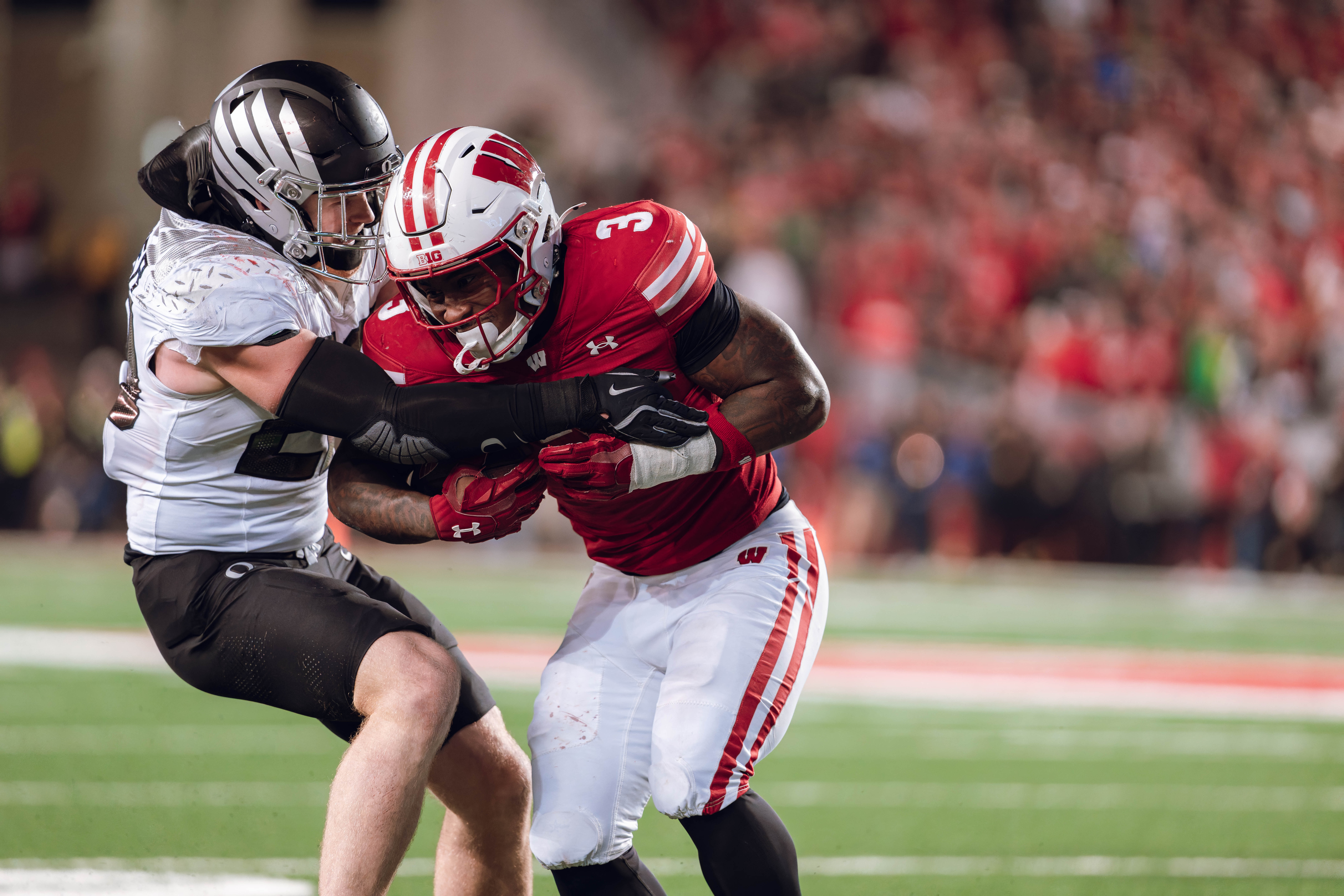 Wisconsin Badgers running back Tawee Walker #3 takes the ball up field against the Oregon Ducks at Camp Randall Stadium on November 16, 2024 in Madison, Wisconsin. Photography by Ross Harried for Second Crop Sports.