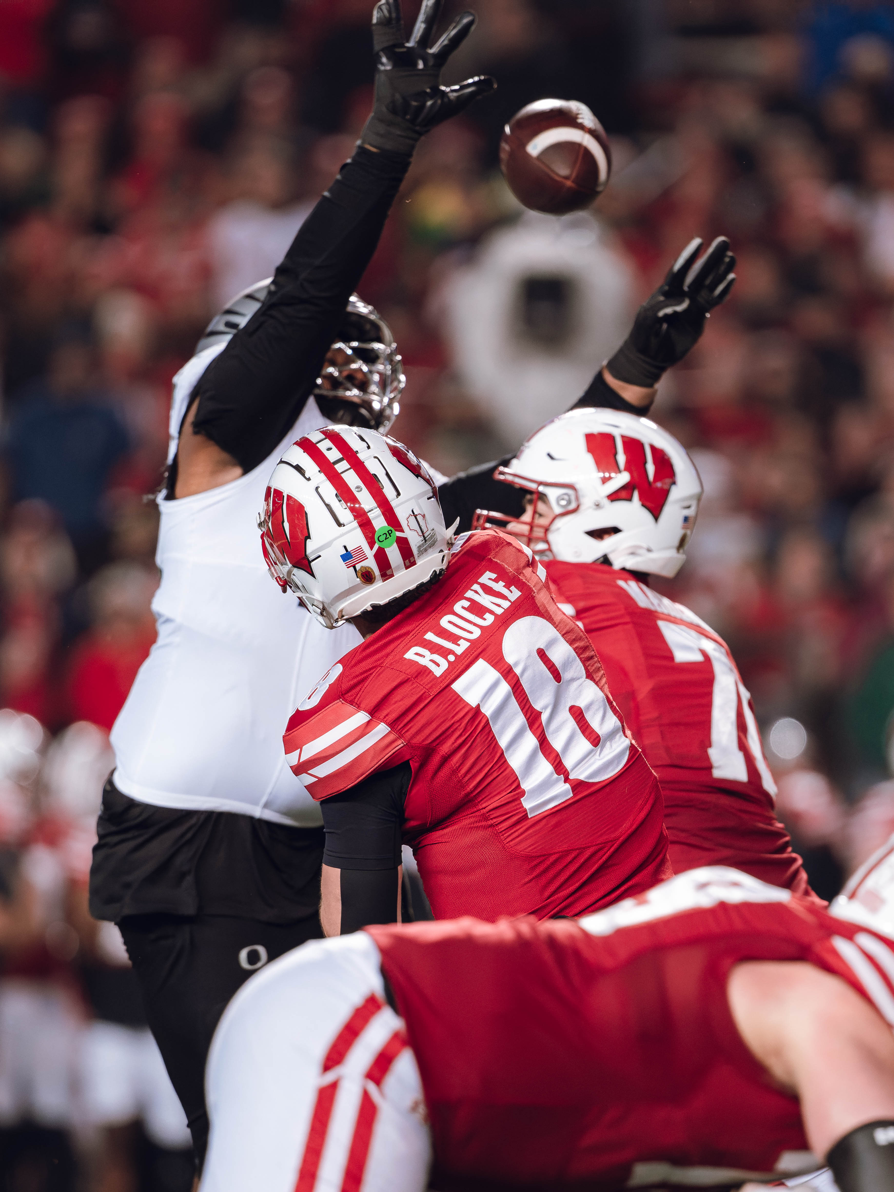 Wisconsin Badgers quarterback Braedyn Locke #18 attempts a pass against the Oregon Ducks at Camp Randall Stadium on November 16, 2024 in Madison, Wisconsin. Photography by Ross Harried for Second Crop Sports.