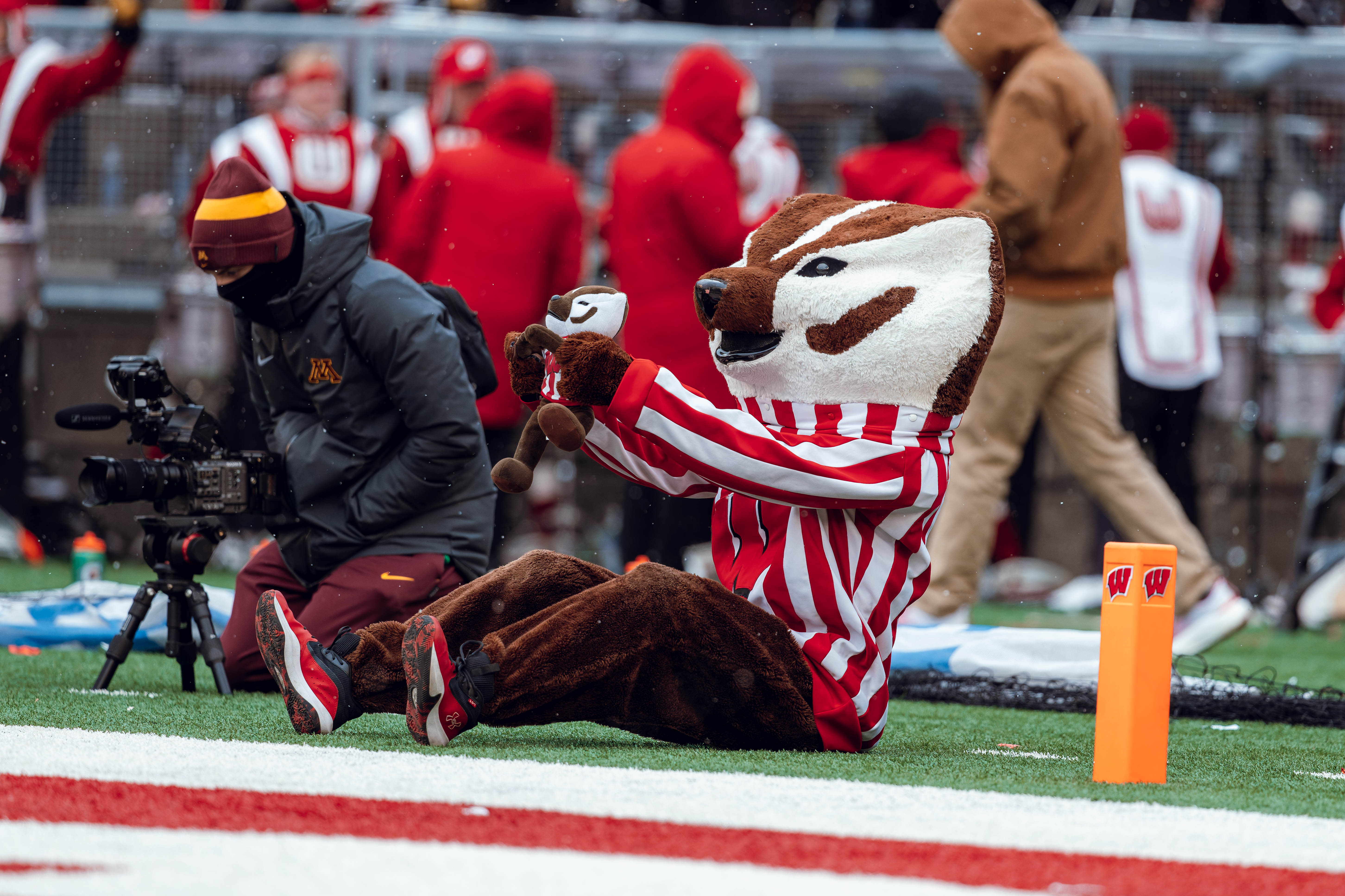 Bucky Badger takes a break with little Bucky as the Wisconsin Badgers take on the Minnesota Golden Gophers at Camp Randall Stadium on November 29, 2024 in Madison, Wisconsin. Photography by Ross Harried for Second Crop Sports.