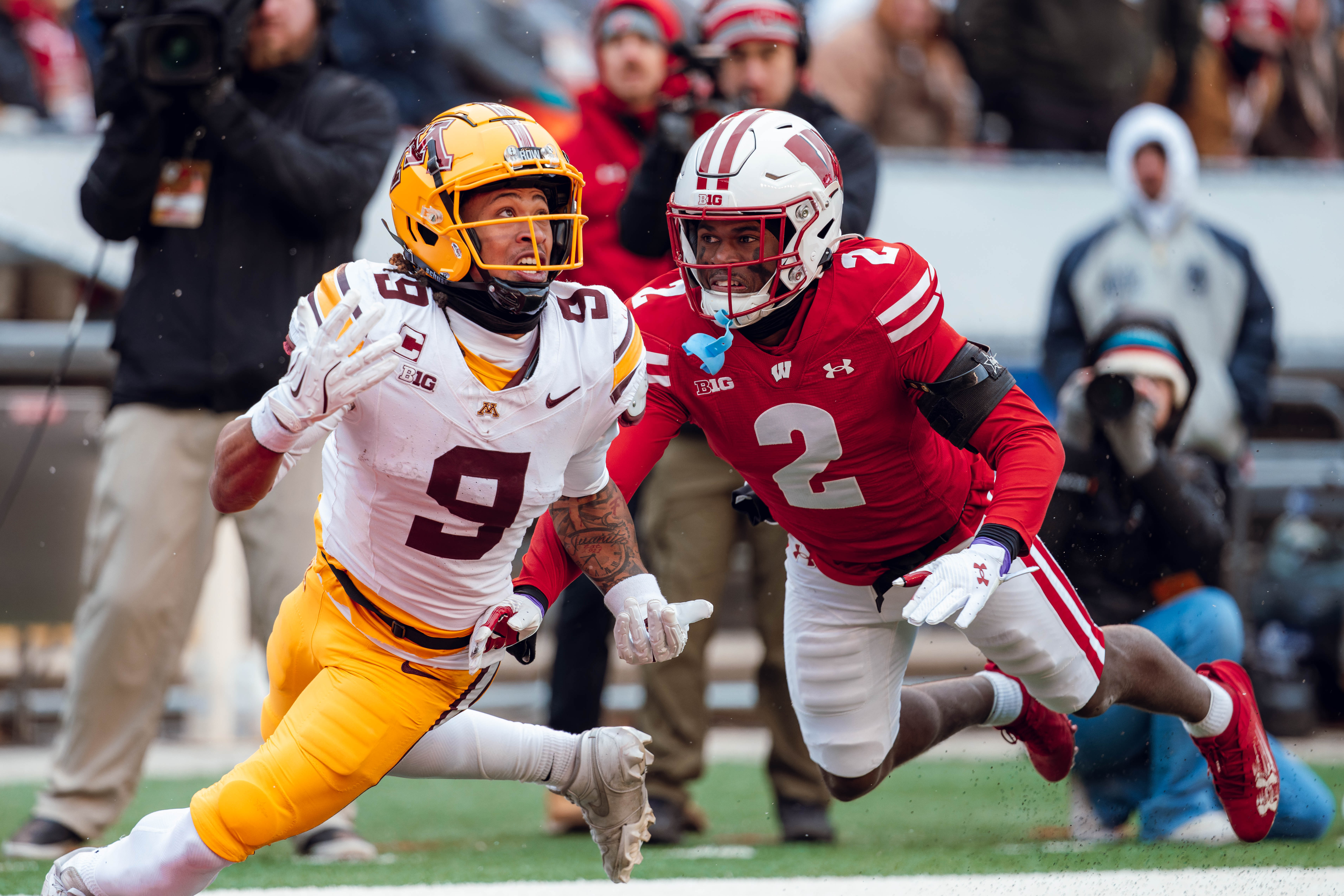 Wisconsin Badgers cornerback Ricardo Hallman #2 defends Minnesota Golden Gopher wide receiver Daniel Jackson #9 at Camp Randall Stadium on November 29, 2024 in Madison, Wisconsin. Photography by Ross Harried for Second Crop Sports.