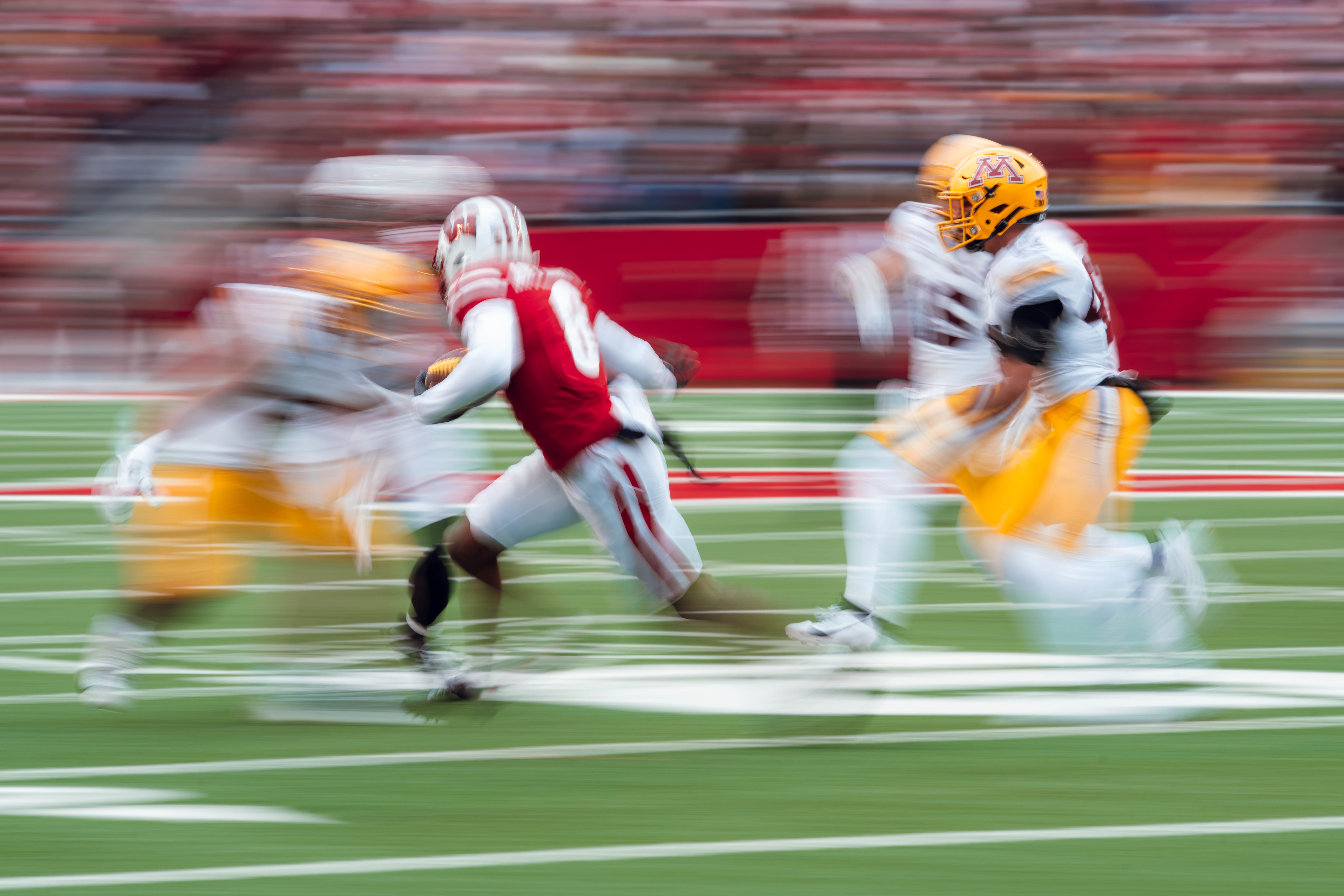 Wisconsin Badgers wide receiver Vinny Anthony II #8 returns a punt against the Minnesota Golden Gophers at Camp Randall Stadium on November 29, 2024 in Madison, Wisconsin. Photography by Ross Harried for Second Crop Sports.