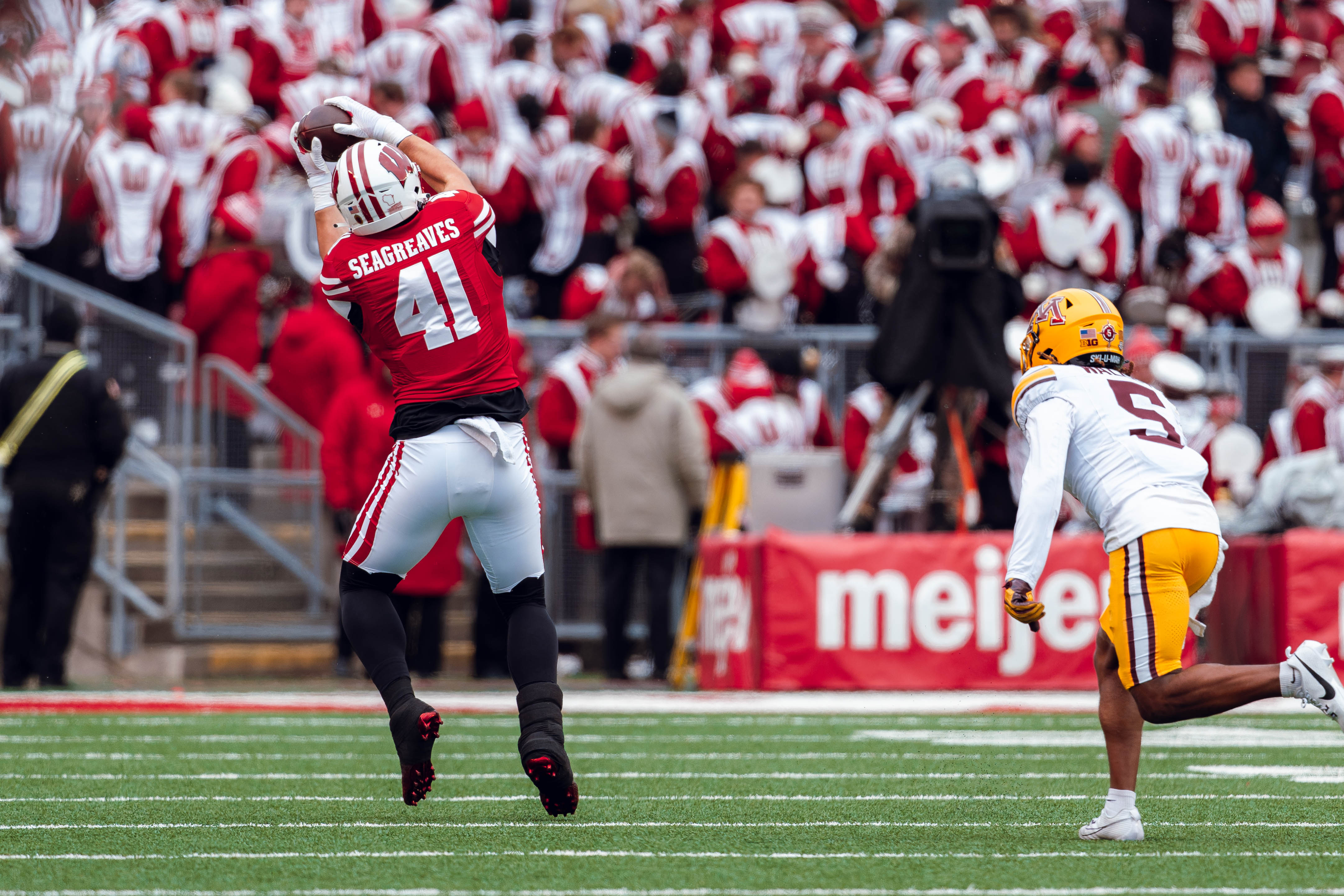 Wisconsin Badgers tight end JT Seagreaves #41 hauls in a pass against the Minnesota Golden Gophers at Camp Randall Stadium on November 29, 2024 in Madison, Wisconsin. Photography by Ross Harried for Second Crop Sports.