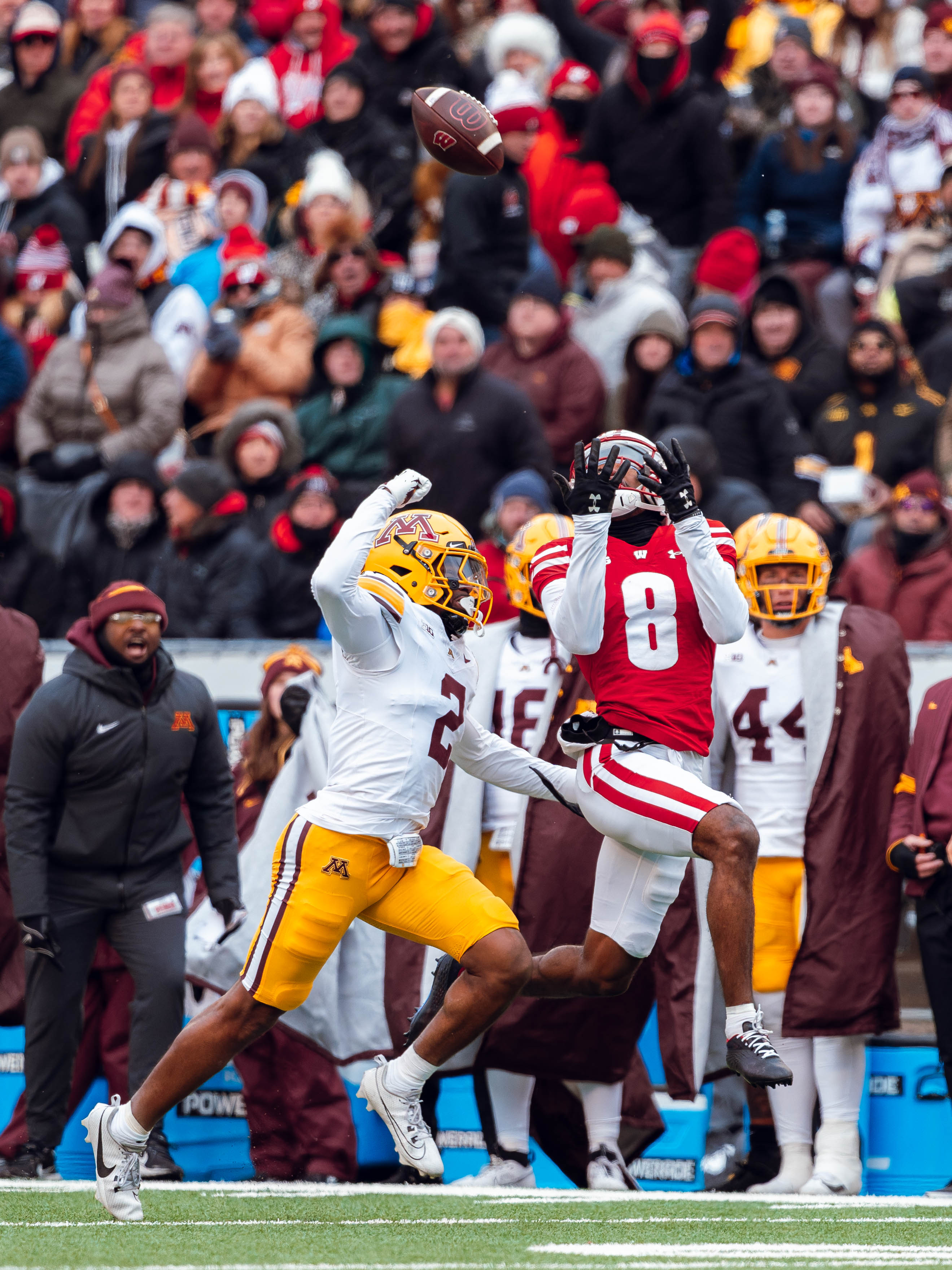 Wisconsin Badgers wide receiver Vinny Anthony II #8 attempts to haul in a deep pass against the Minnesota Golden Gophers at Camp Randall Stadium on November 29, 2024 in Madison, Wisconsin. Photography by Ross Harried for Second Crop Sports.