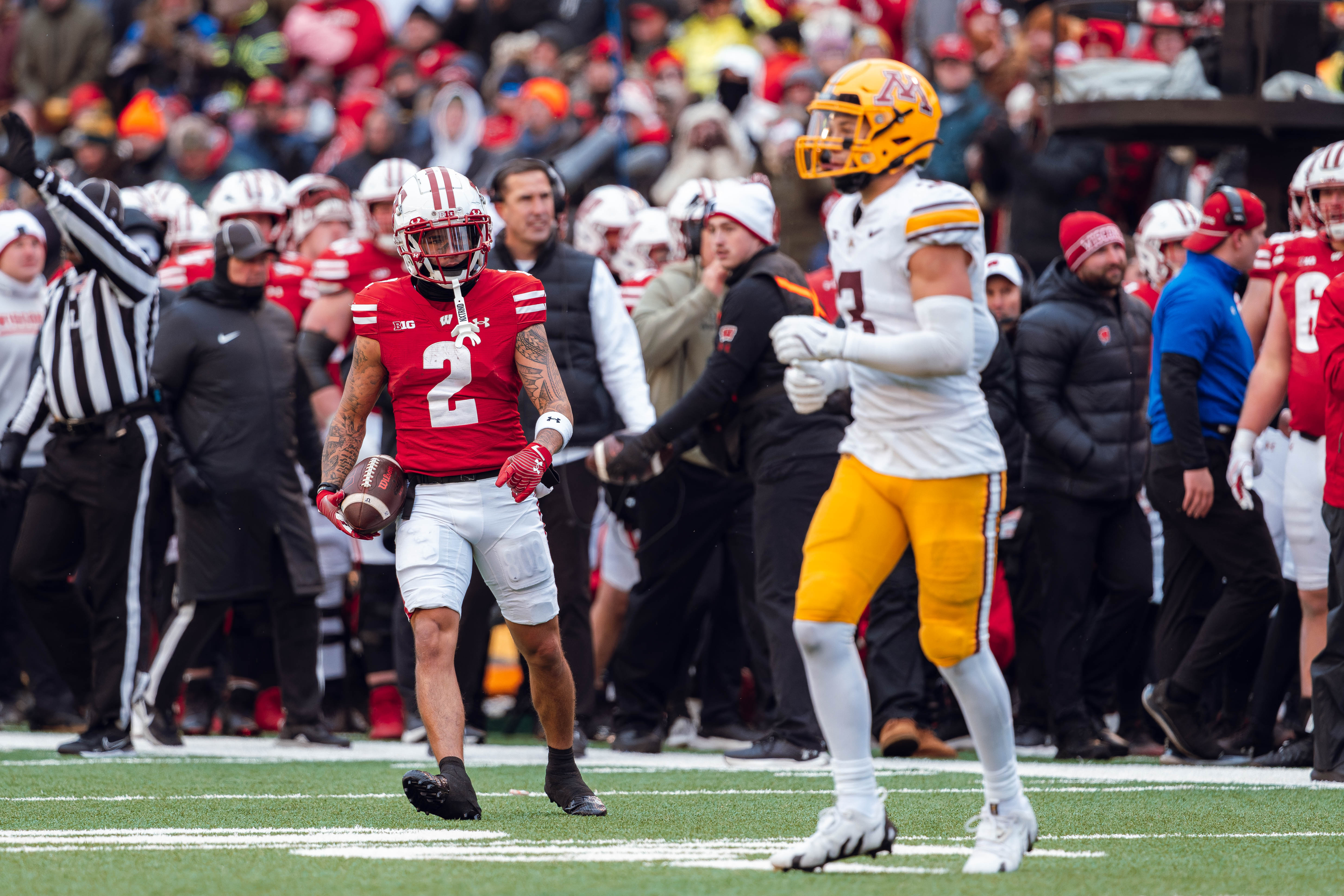 Wisconsin Badgers wide receiver Trech Kekahuna #2 stares down Minnesota Golden State nGopher defensive back Koi Perich #3 after a big play at Camp Randall Stadium on November 29, 2024 in Madison, Wisconsin. Photography by Ross Harried for Second Crop Sports.