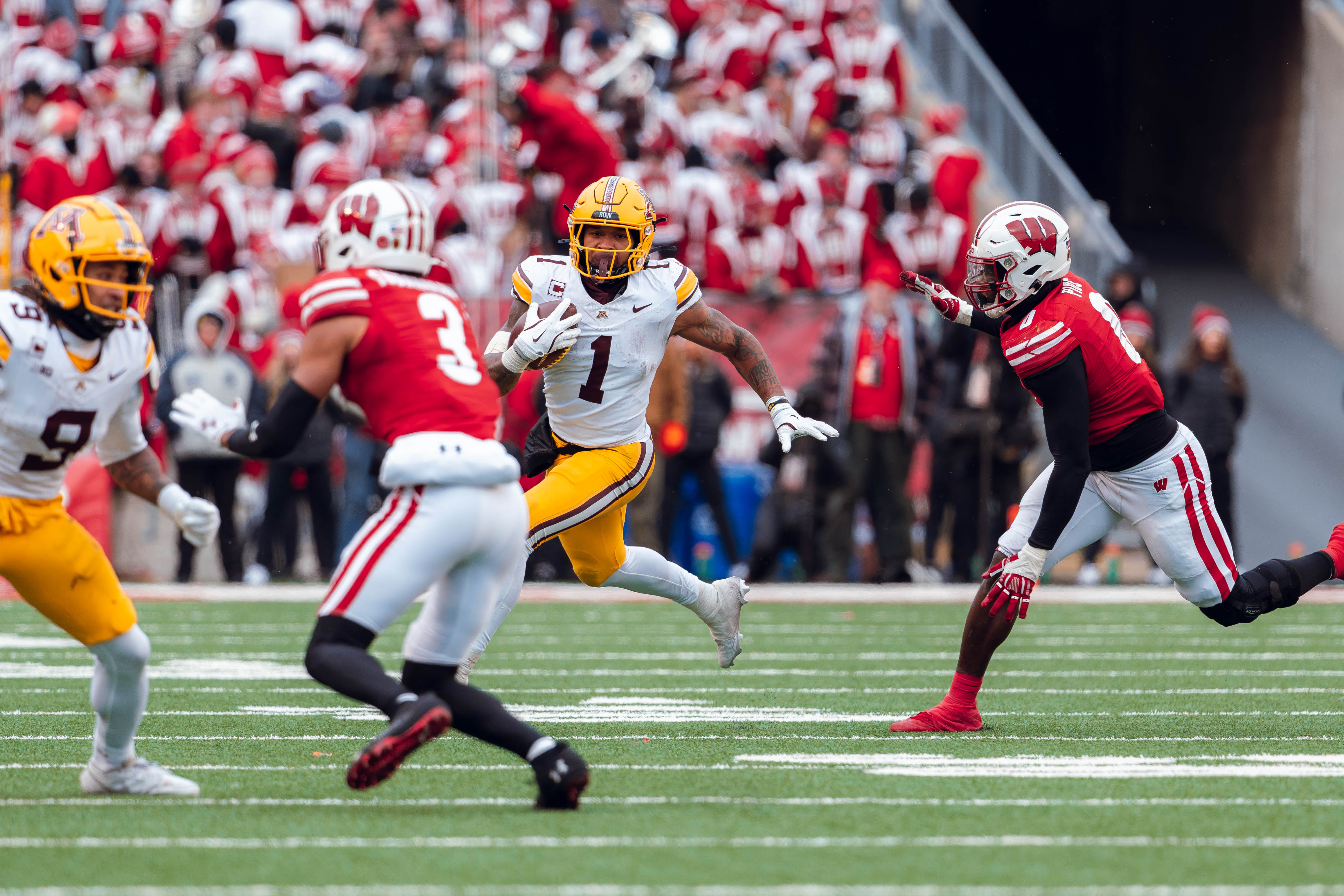 Minnesota Golden Gopher running back Darius Taylor #1 runs the ball against the Wisconsin Badgers at Camp Randall Stadium on November 29, 2024 in Madison, Wisconsin. Photography by Ross Harried for Second Crop Sports.