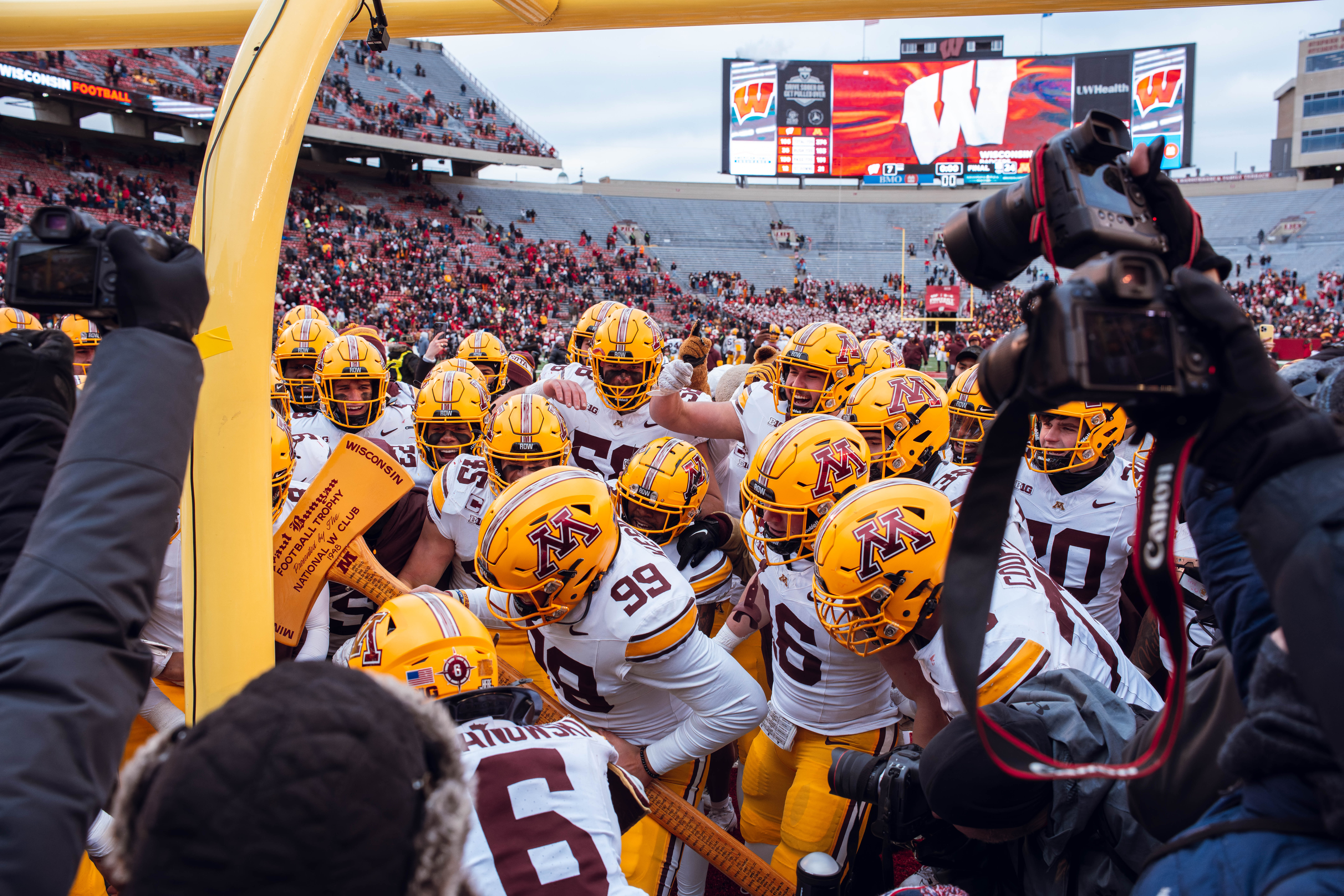 The Minnesota Golden Gophers take home the Paul Bunyan Axe against the Wisconsin Badgers at Camp Randall Stadium on November 29, 2024 in Madison, Wisconsin. Photography by Ross Harried for Second Crop Sports.