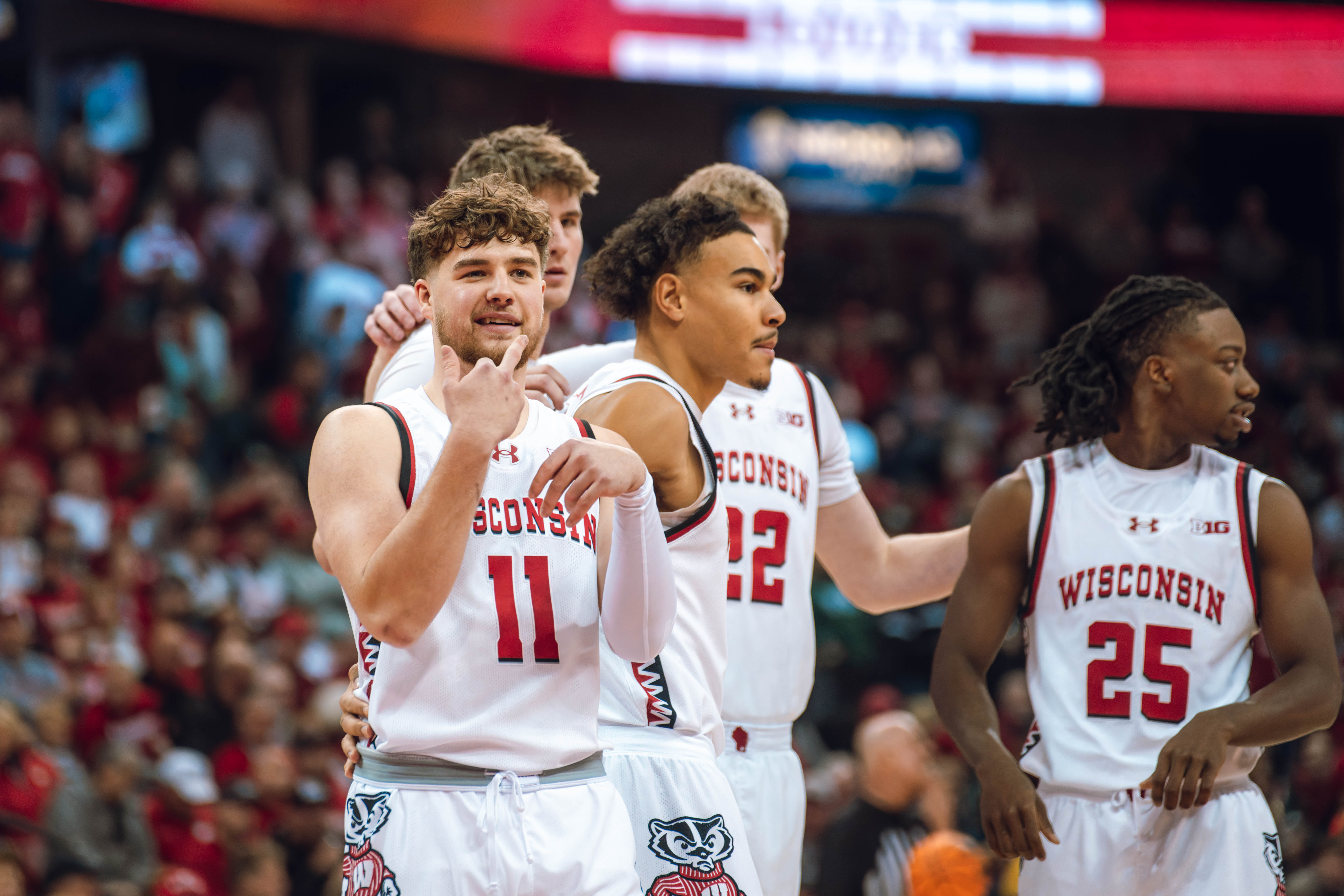 Wisconsin Badgers guard Max Klesmit #11 communicates with the bench before taking on the Michigan Wolverines at the Kohl Center on December 03, 2024 in Madison, Wisconsin. Photography by Ross Harried for Second Crop Sports.