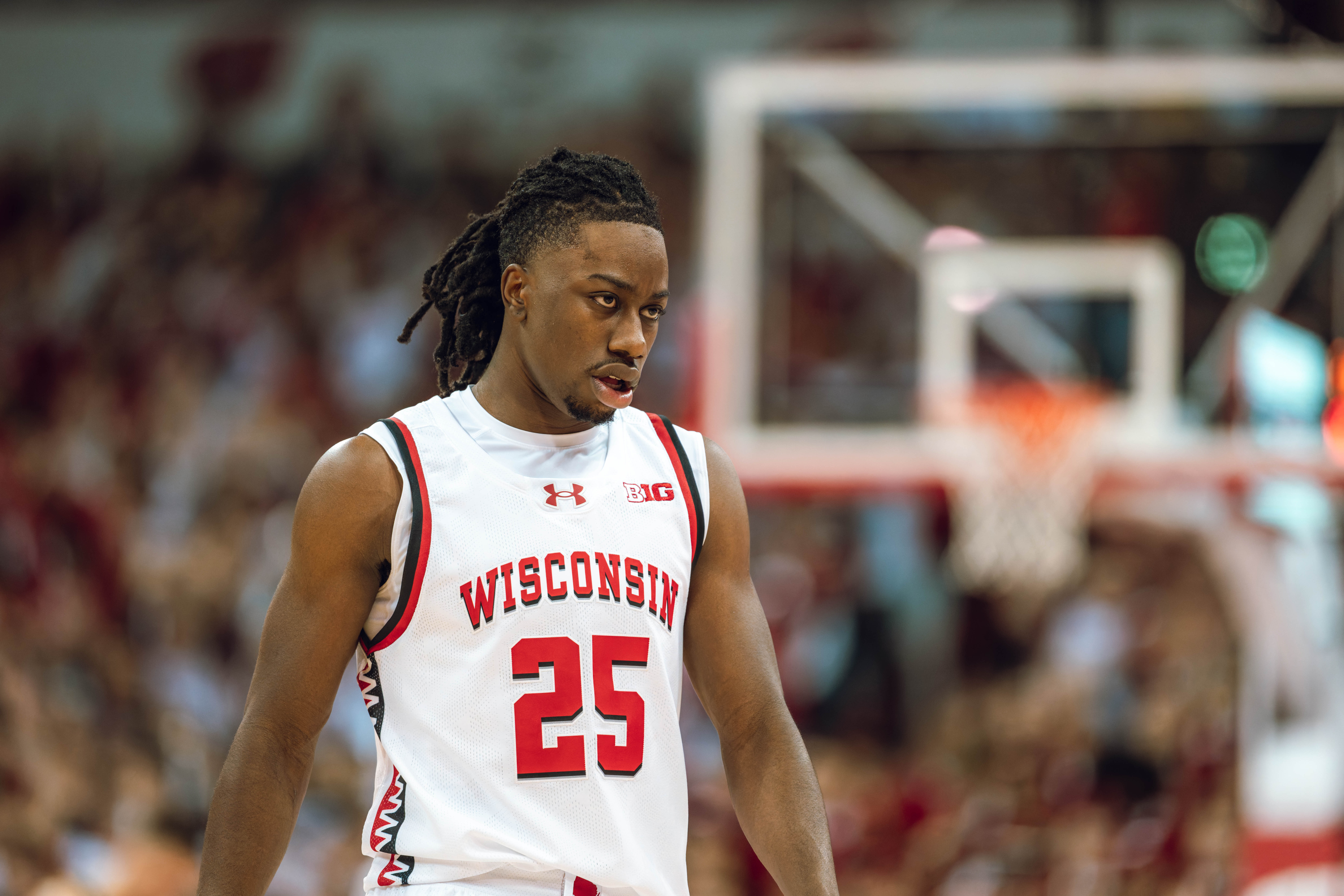 Wisconsin Badgers guard John Blackwell #25 looks at the bench against the Michigan Wolverines at the Kohl Center on December 03, 2024 in Madison, Wisconsin. Photography by Ross Harried for Second Crop Sports.